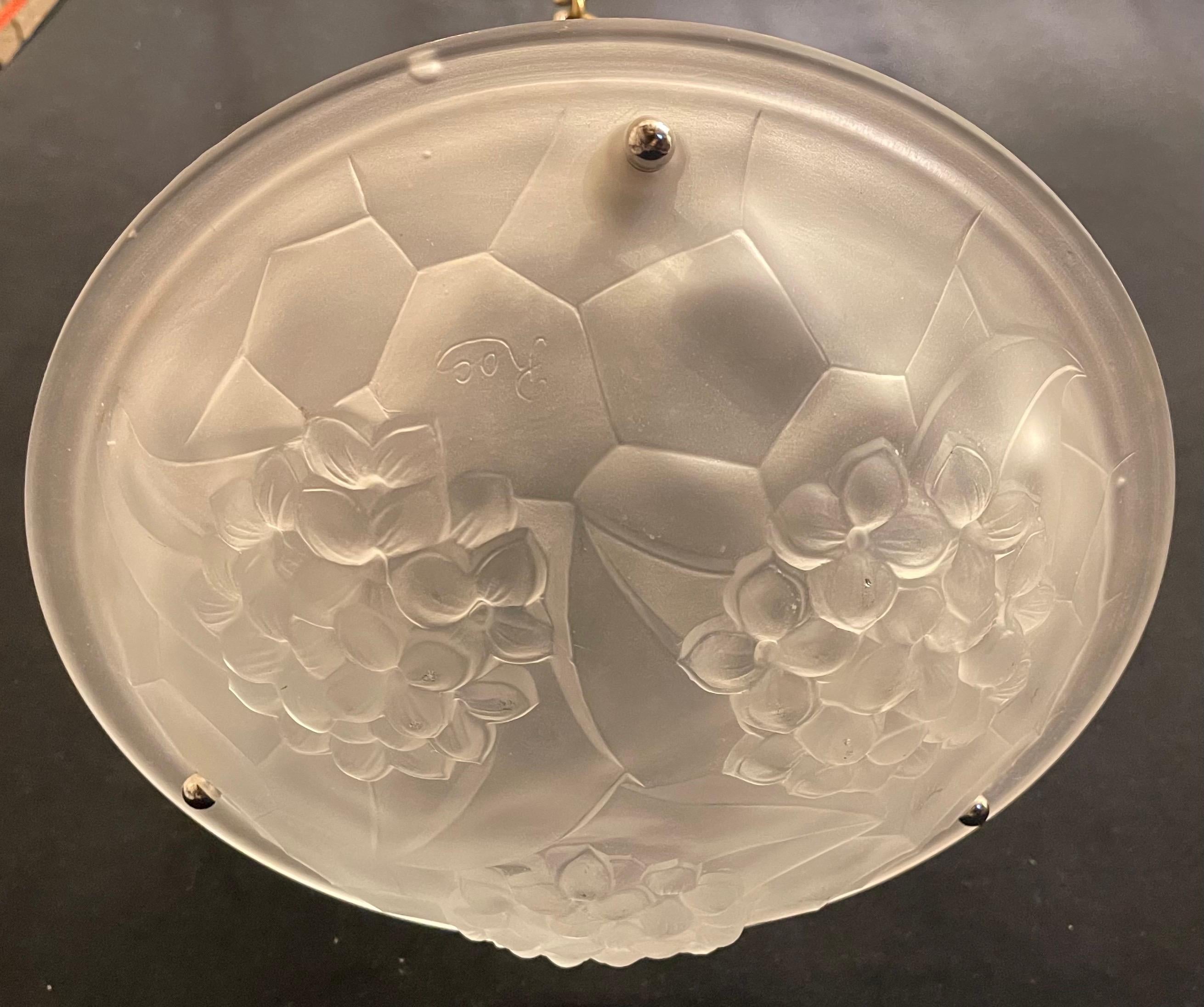 A wonderful mid century Art Deco glass bowl with polished nickel light fixture having 3 internal candelabra sockets, this pendent is adjustable in height.