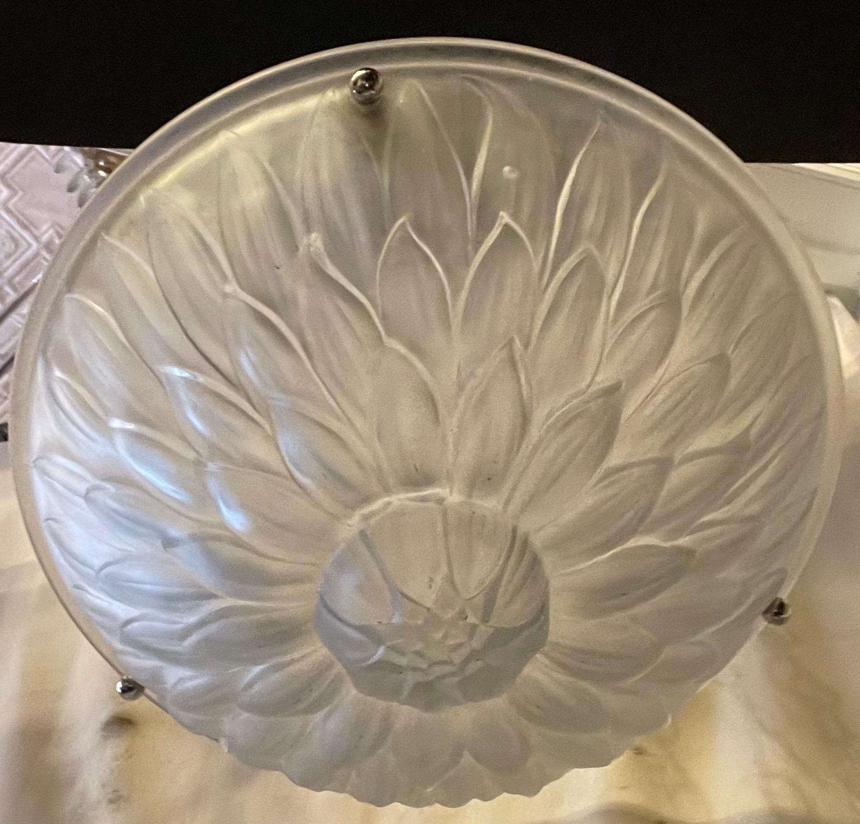 A Wonderful French mid century Art Deco sunflower pattern round frosted glass bowl with polished nickel canopy and chain, this light fixture has been rewired with 3 new candelabra sockets and the height is adjustable with the addition or removal of