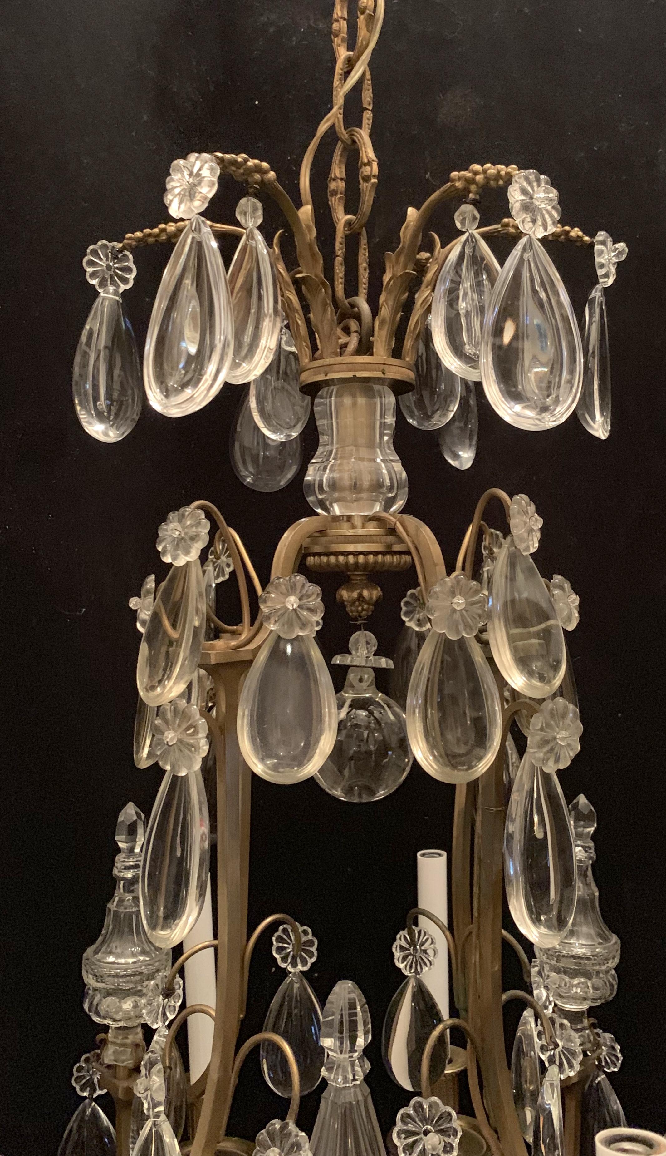 A wonderful French neoclassical bronze and crystal Regency 9-light chandelier
8 arms and center obelisk contains a light as well
Completely rewired.