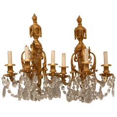 Wonderful French Neoclassical Pair of Doré Bronze Crystal Swag Urn Flame Sconces