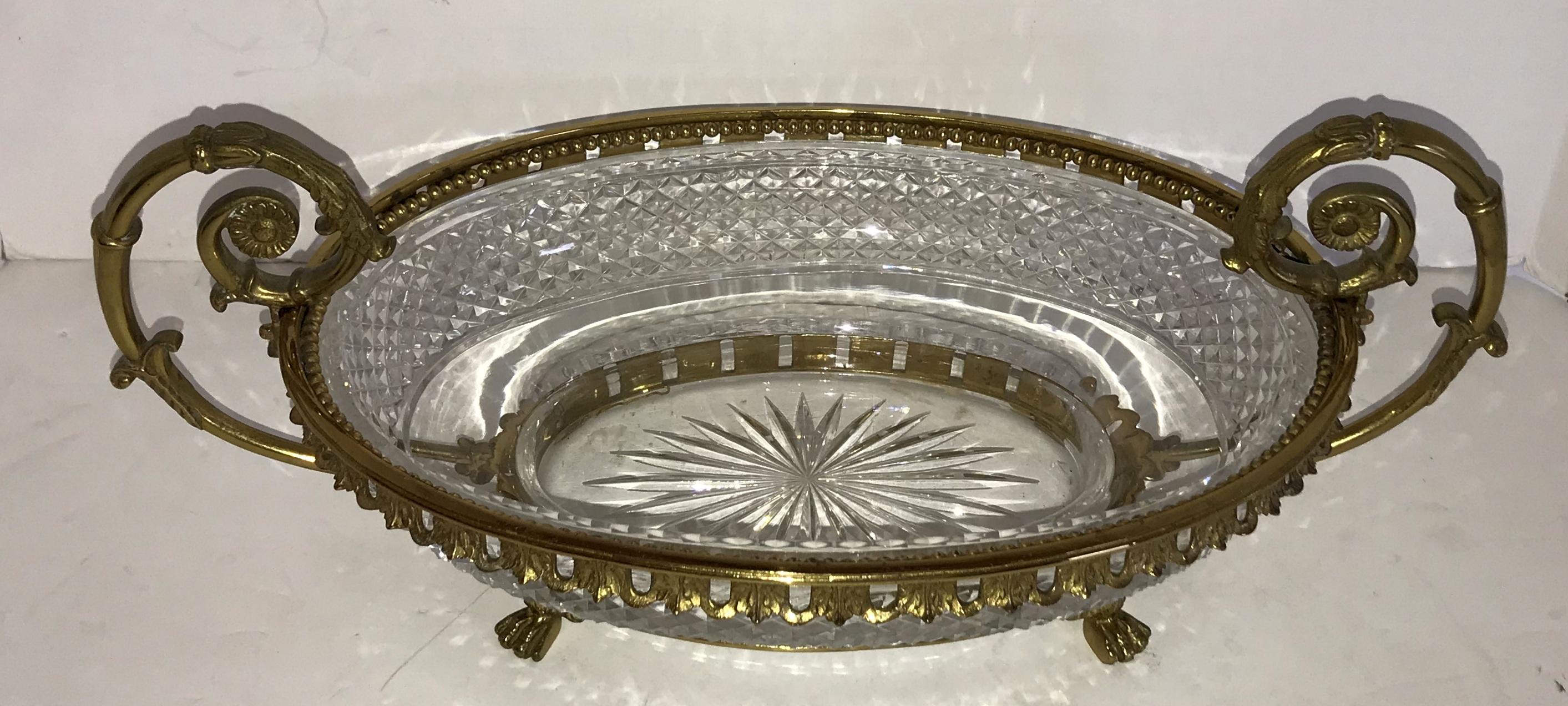 Wonderful large oval French neoclassical ormolu doré bronze and diamond cut crystal oval centerpiece / Jardinière with lions feet and double handles.

Measures: 17.5