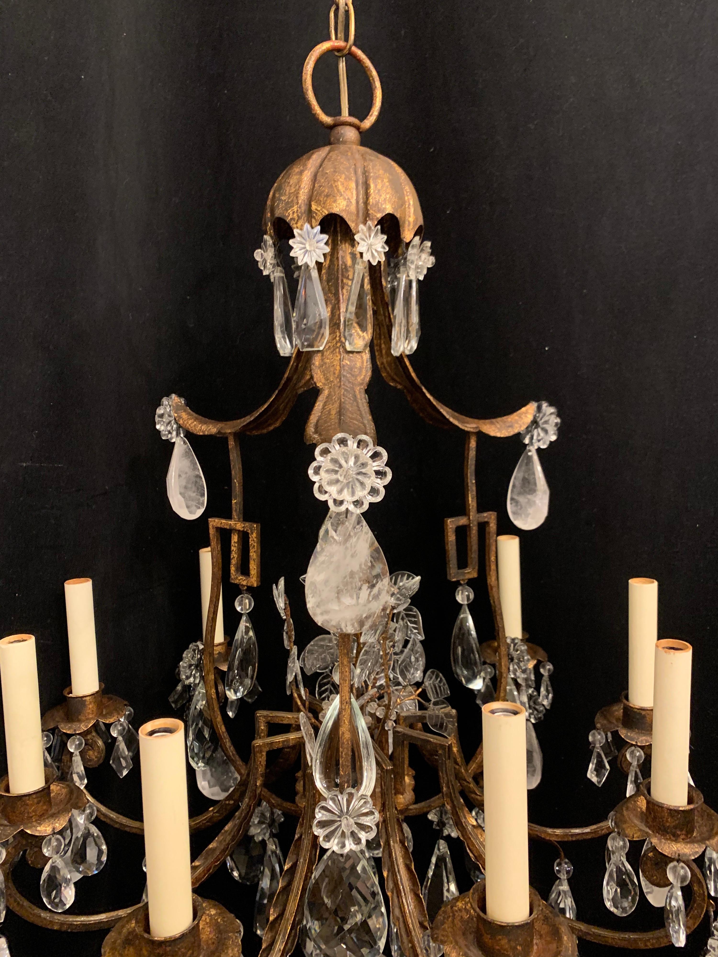 A wonderful French pagoda shaped gold gilt and rock crystal Baguès style chandelier with nine candelabra lights this fixture is rewired and comes with chain canopy and mounting hardware for installation.