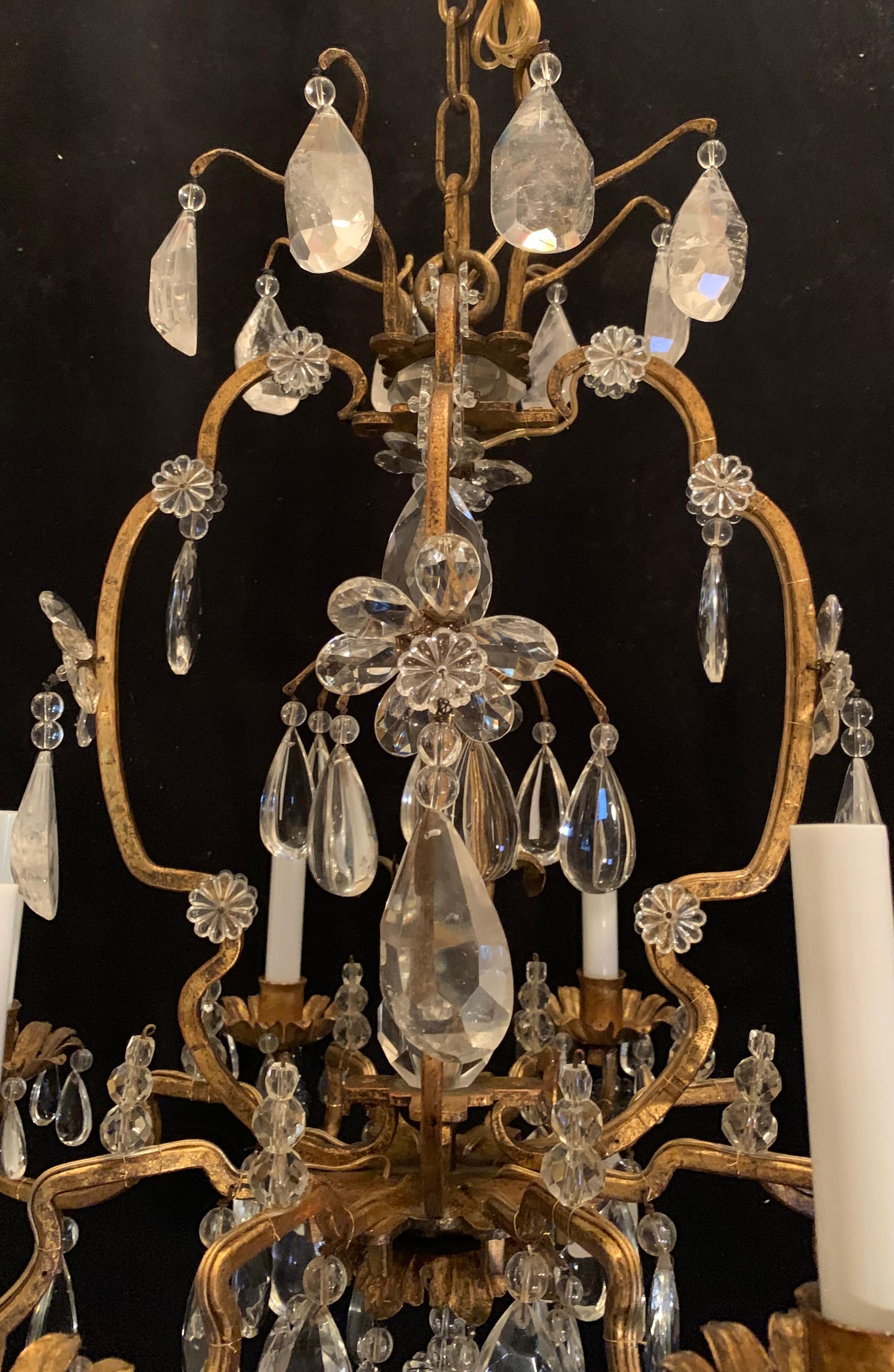 A wonderful rock crystal and gold gilt Baguès / Louis XVI style 8 candelabra light, bird cage form chandelier, completely rewired with new sockets.