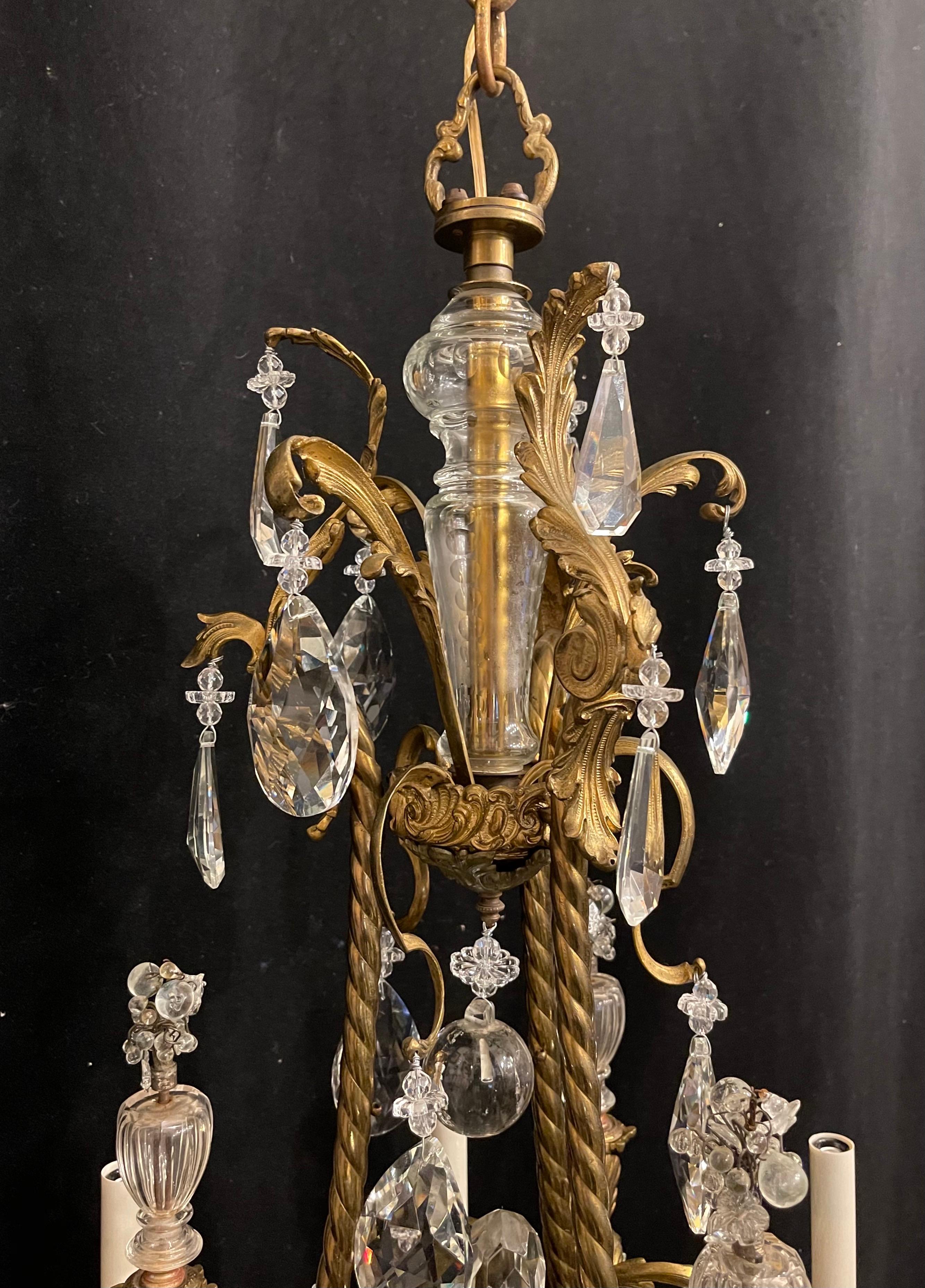 A wonderful French Rococo gilt bronze garland cage & crystal basket chandelier with 6 candelabras light, completely rewired with new sockets and comes with chain canopy and mounting hardware for installation.