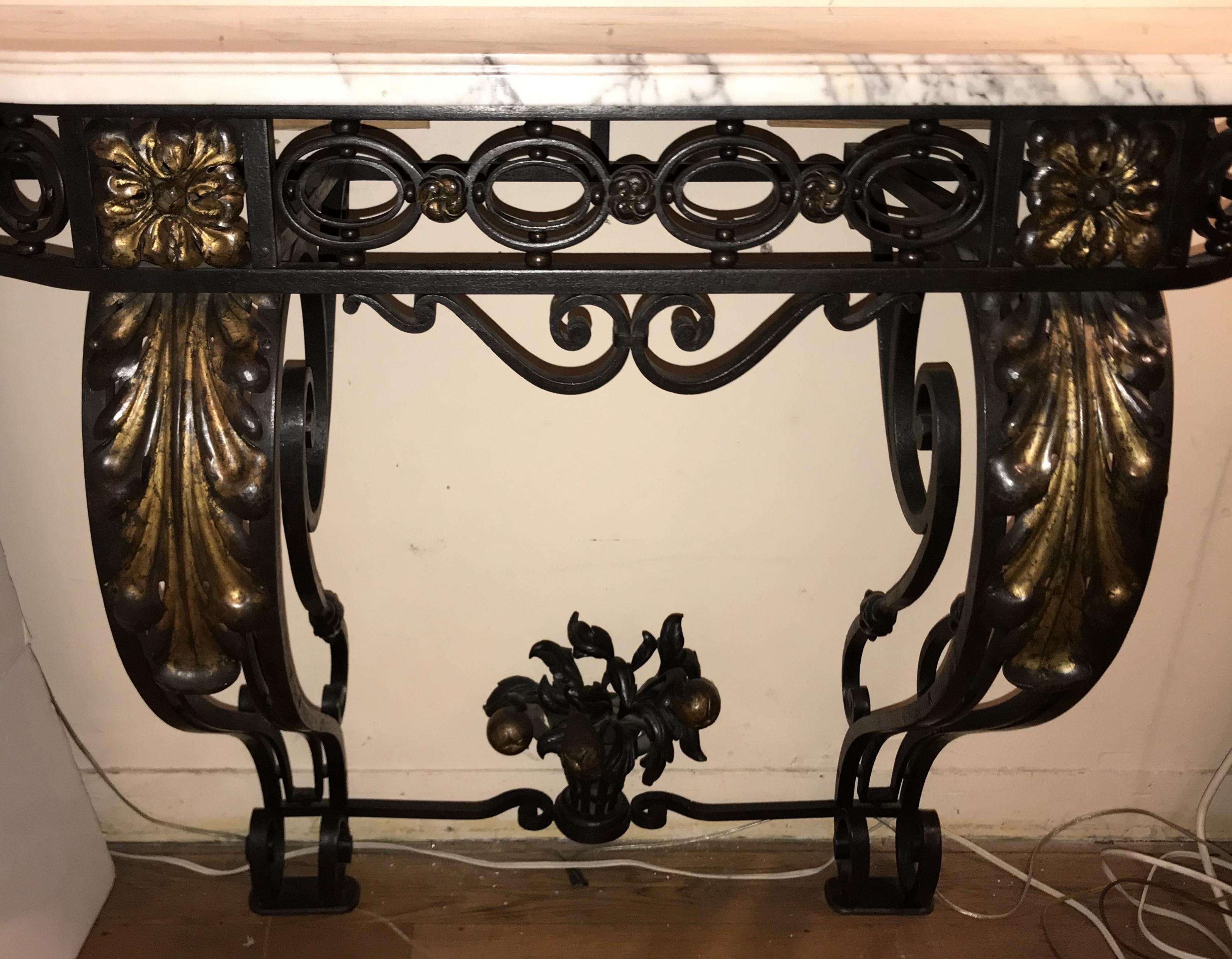 Wonderful French, late 19th century Baroque atyle wrought iron and gilt wall mounting console table with Carrera white marble top in the Louis XV style, Paris, circa 1920s.

Measures: 48