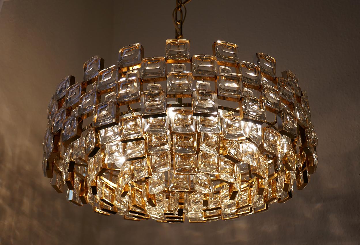 Wonderful crystal glass, gold plated brass pendant chandelier.
Germany, 1960s.
Measures:
Diameter 22 in
Height (body) 13 in
Lamp sockets: 10.