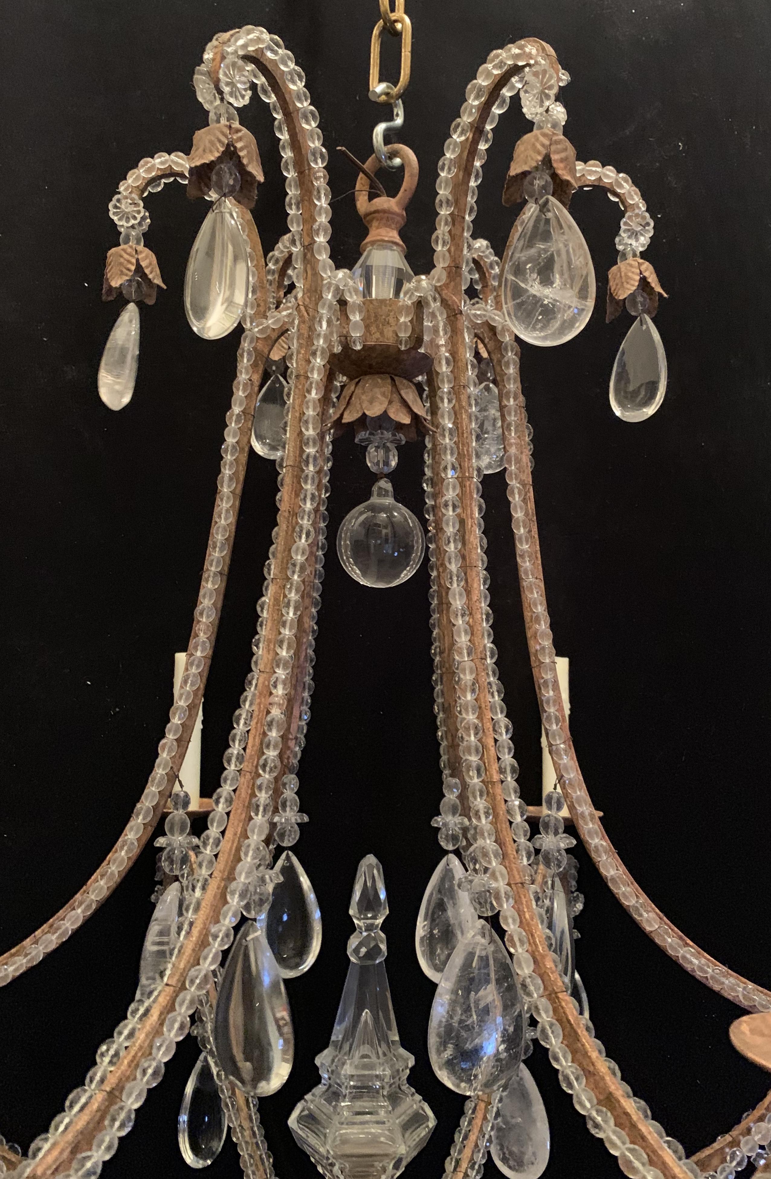 Wonderful salmon gilt iron 6-light rock crystal beaded large Baguès/ Jansen manner clean modern chandelier with crystal obelisk center finial.