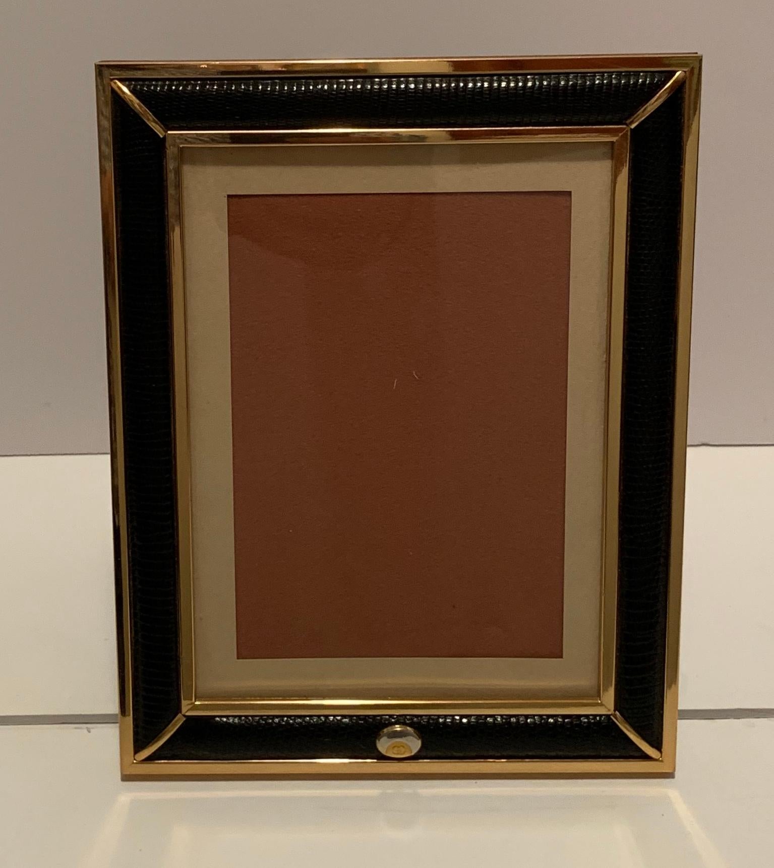 A wonderful stamped Gucci / Made In Italy brass and snake skin pattern picture frame with wood back.