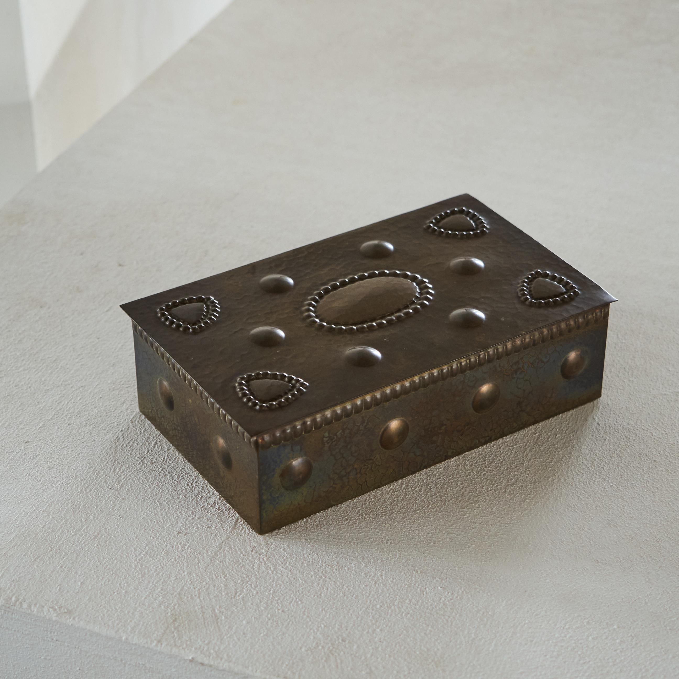 Wonderful Hand Hammered Art Deco Box 1930s

Just look at this box! A wonderful art deco gem, hand hammered and blessed with a desirable patina. Great design and no doubt a conversation piece on your desk or table. Also very practical indeed due to