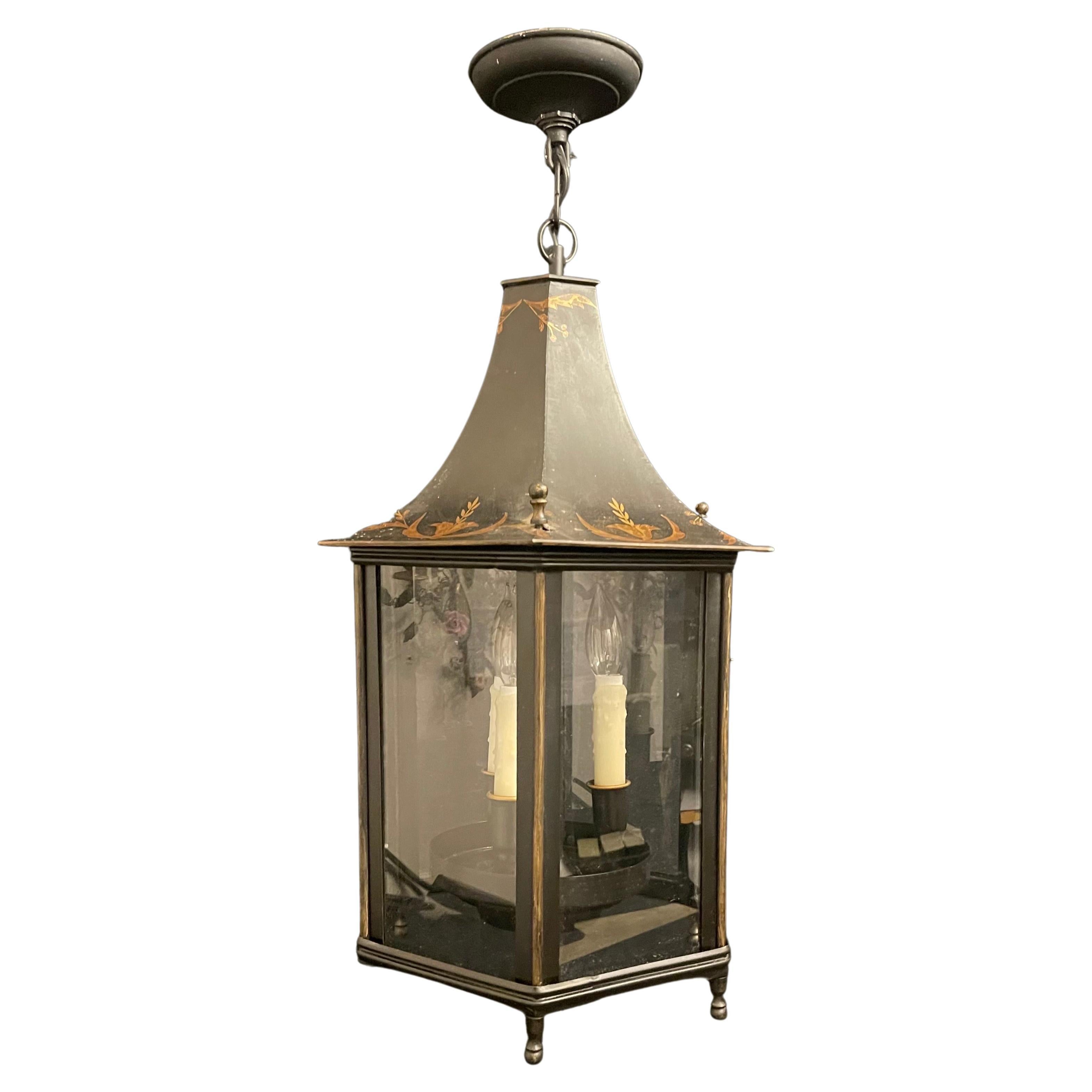 A Wonderful Black Tole with Antique Gold Hand Painted decoration, Pagoda Octagonal Form Chinoiserie Lantern Pendent Fixture Having 3 Candelabra Lights.
Accompanied By Chain Canopy And Mounting Hardware For Installation.