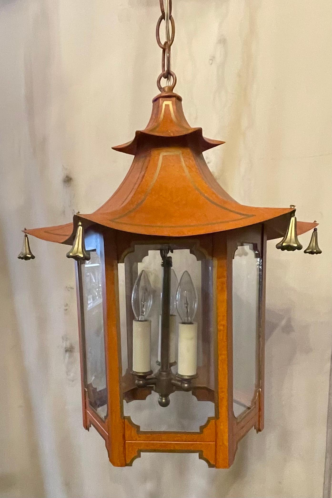 A wonderful hand painted tole orange and gold gilt accent pagoda square glass chinoiserie lantern fixture with matching canopy.