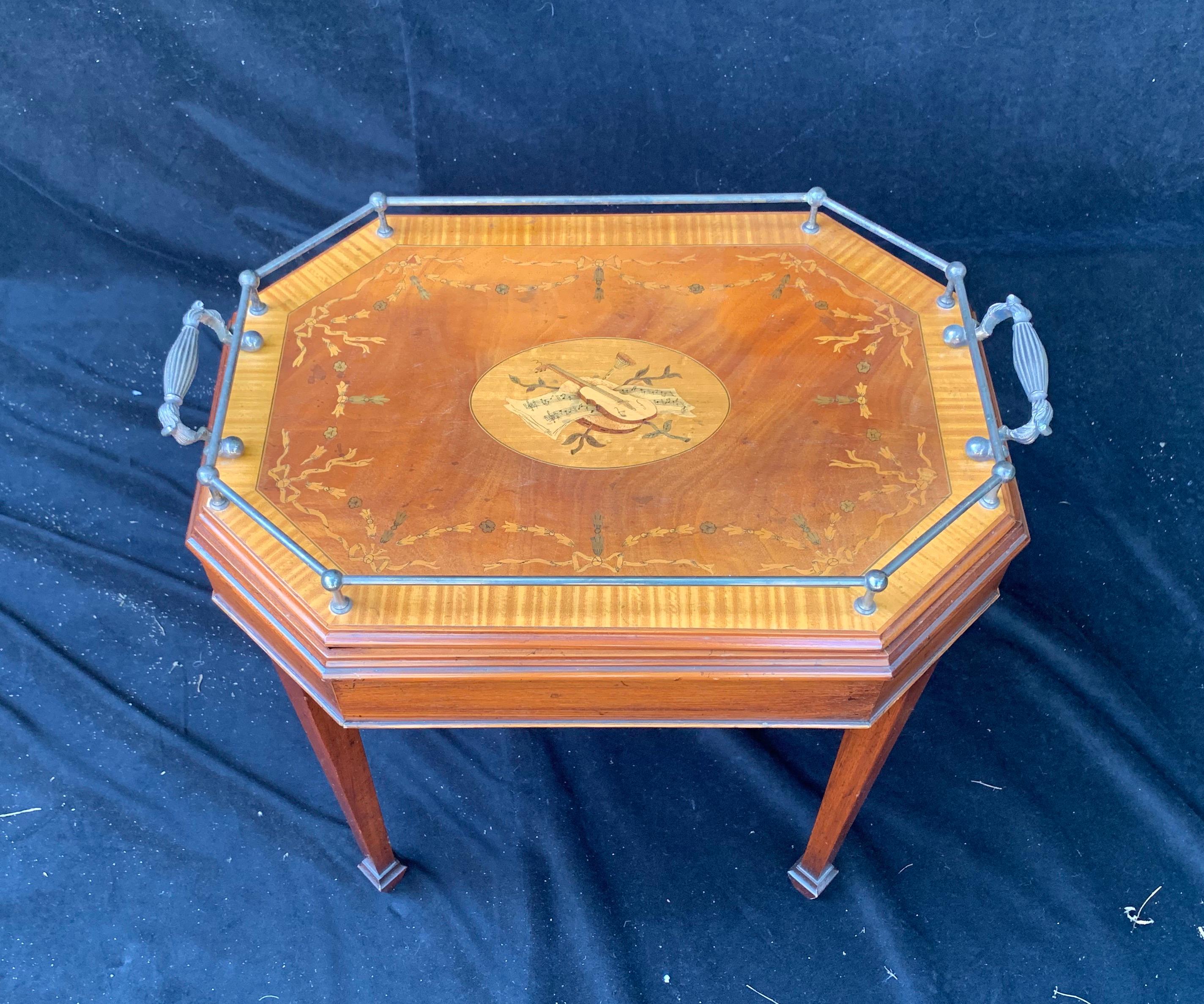 A wonderful inlaid musical scene marquetry removable gallery tray table with silver plated handles and trim.