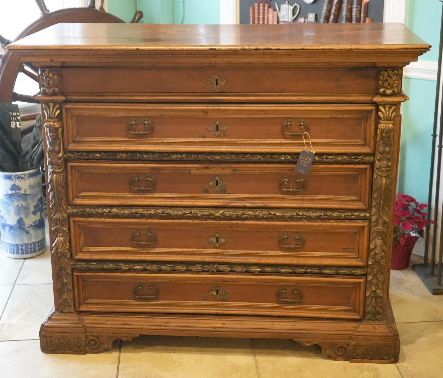 Large 18th Ct. Walnut Italian Chest of Drawers. Wonderful original condition. Walnut with nicely detailed carved sides and in-between drawers. 5 drawers.