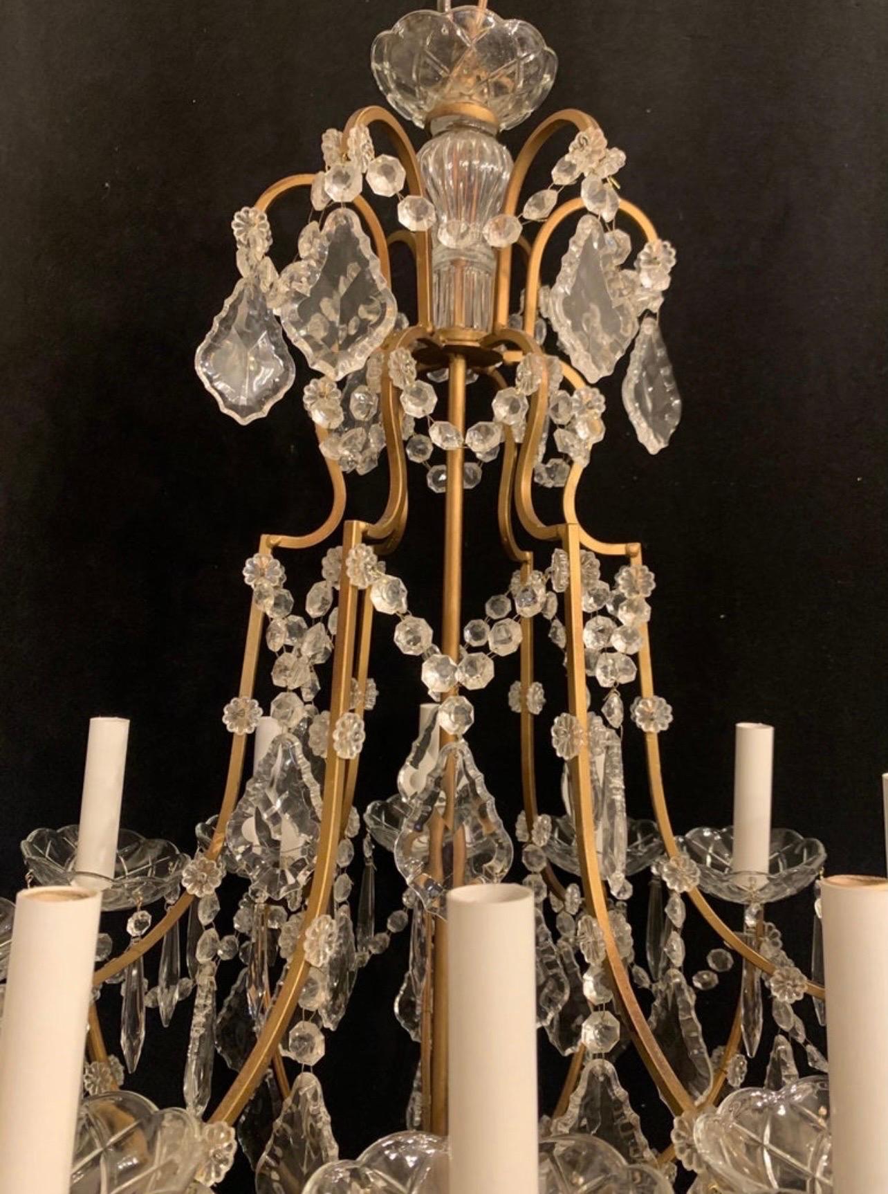 A wonderful Italian crystal and gold gilt 12 candelabras light fixture chandelier, rewired and ready to enjoy with chain canopy and mounting hardware included.