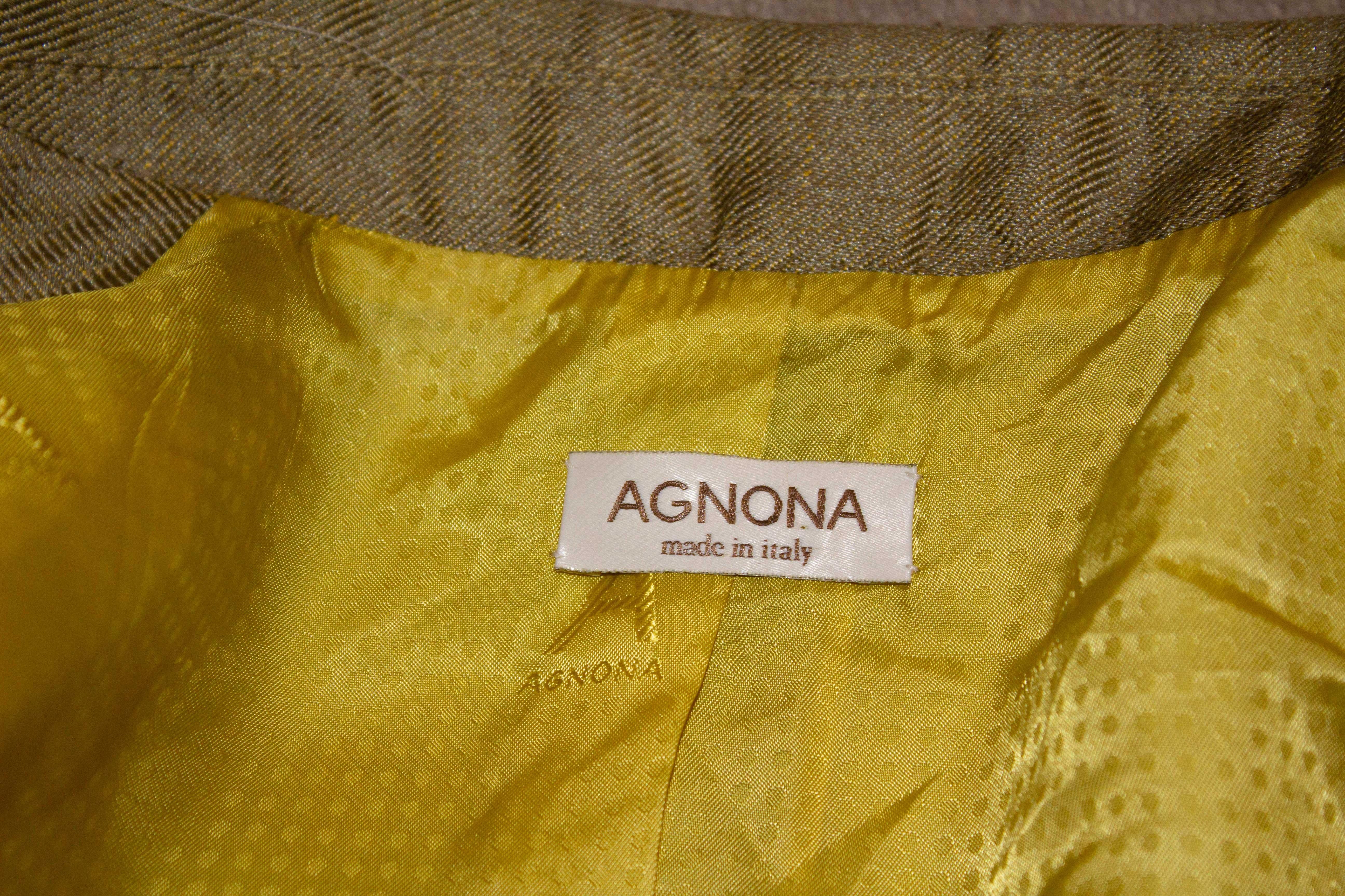 A wonderful jacket by Agnona, the luxury Italian company. The blazer is in a wool / silk mix, with a three button fastening, two pockets,  attractive stitch detail, and great buttons. It is unlined.
Size 42 Measurements : Bust up to 35'', length