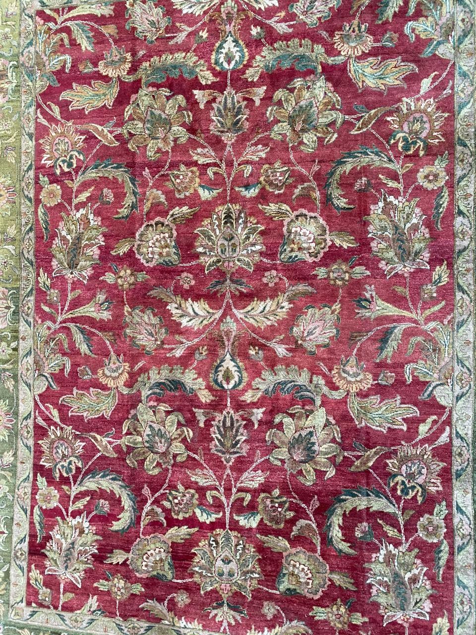 Very beautiful large Indian Agra rug with nice decorative design and beautiful colors with red and green, entirely hand knotted with wool velvet on cotton foundation.