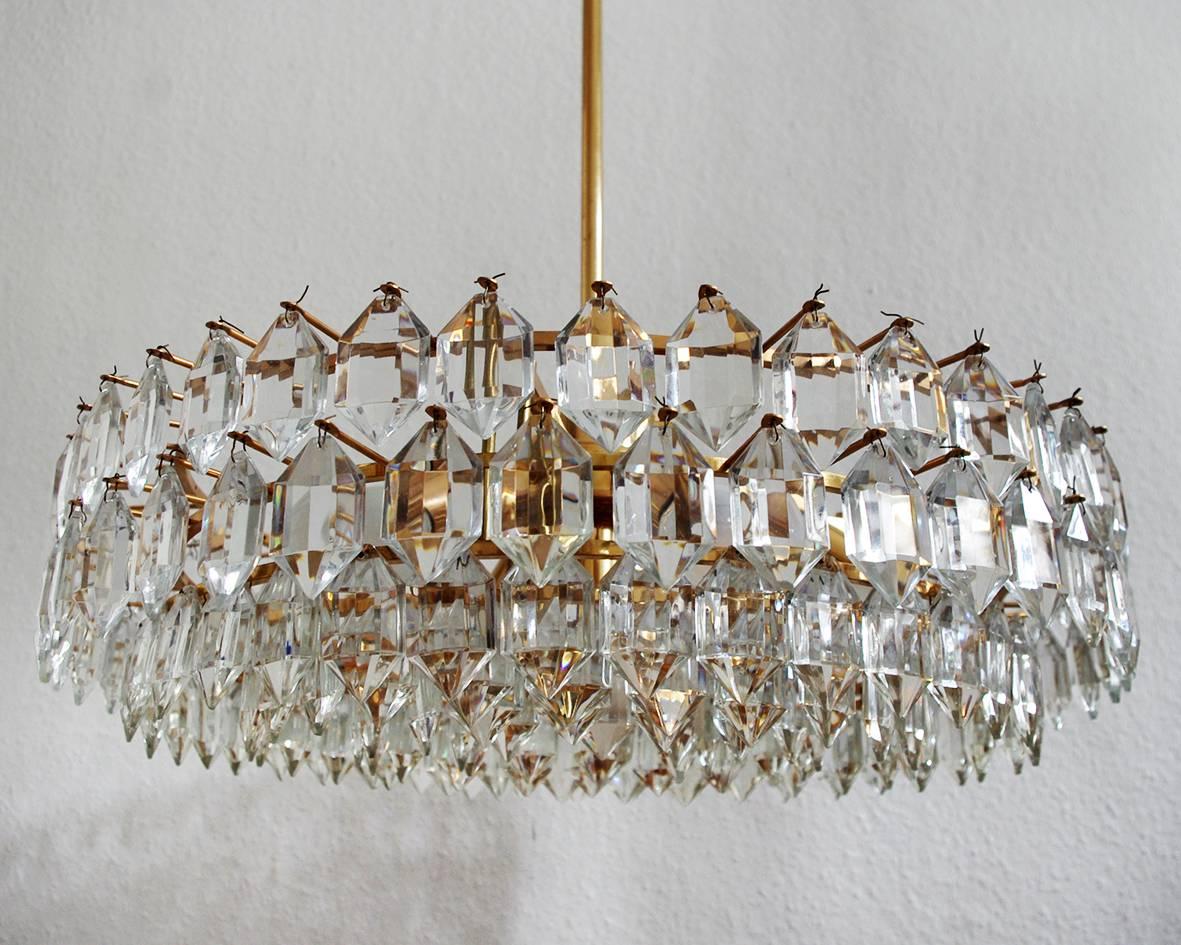 One of... wonderful crystal glass and brass pendant/chandelier.
Austria, 1960s. 
Height (body) 8.6 in
The overall height can be customized.


 