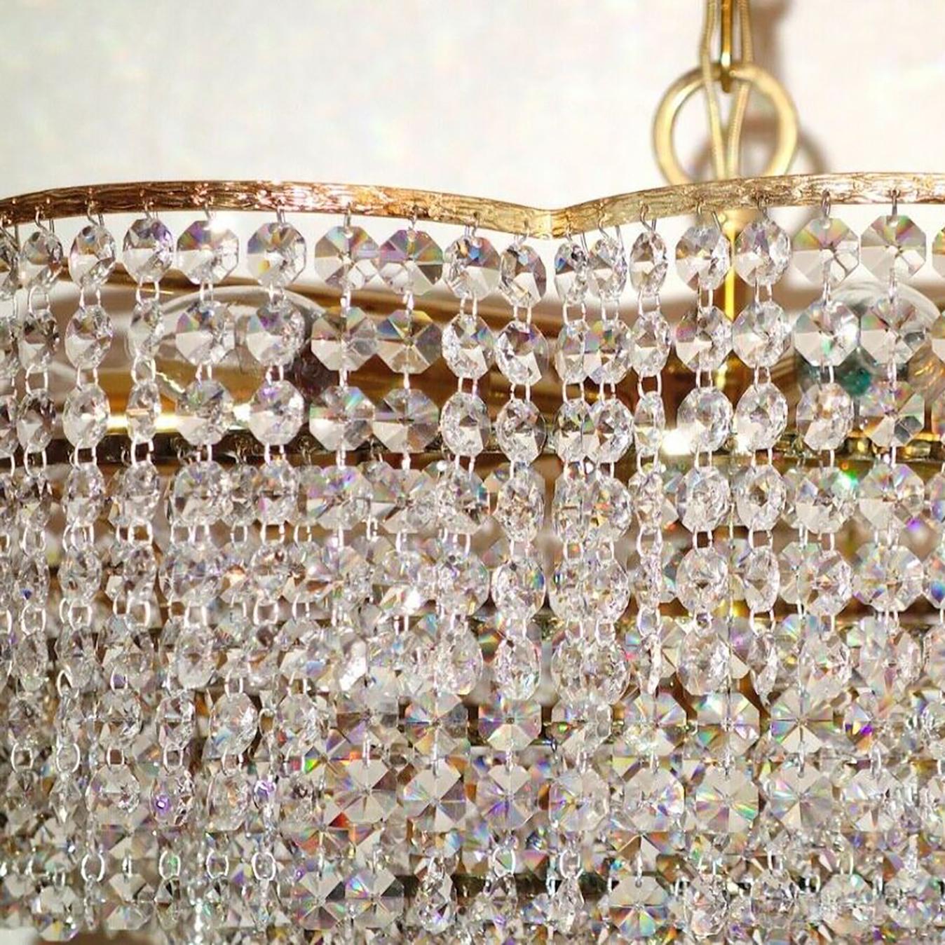 Beautiful brass crystal Palwa chandelier. Finest handwork and enormous. Very beautiful decorations and lead crystal hangings. The body of the chandelier is made of brass. Manufactured in midcentury, circa 1970 (late 1960s or early 1970s).

In good