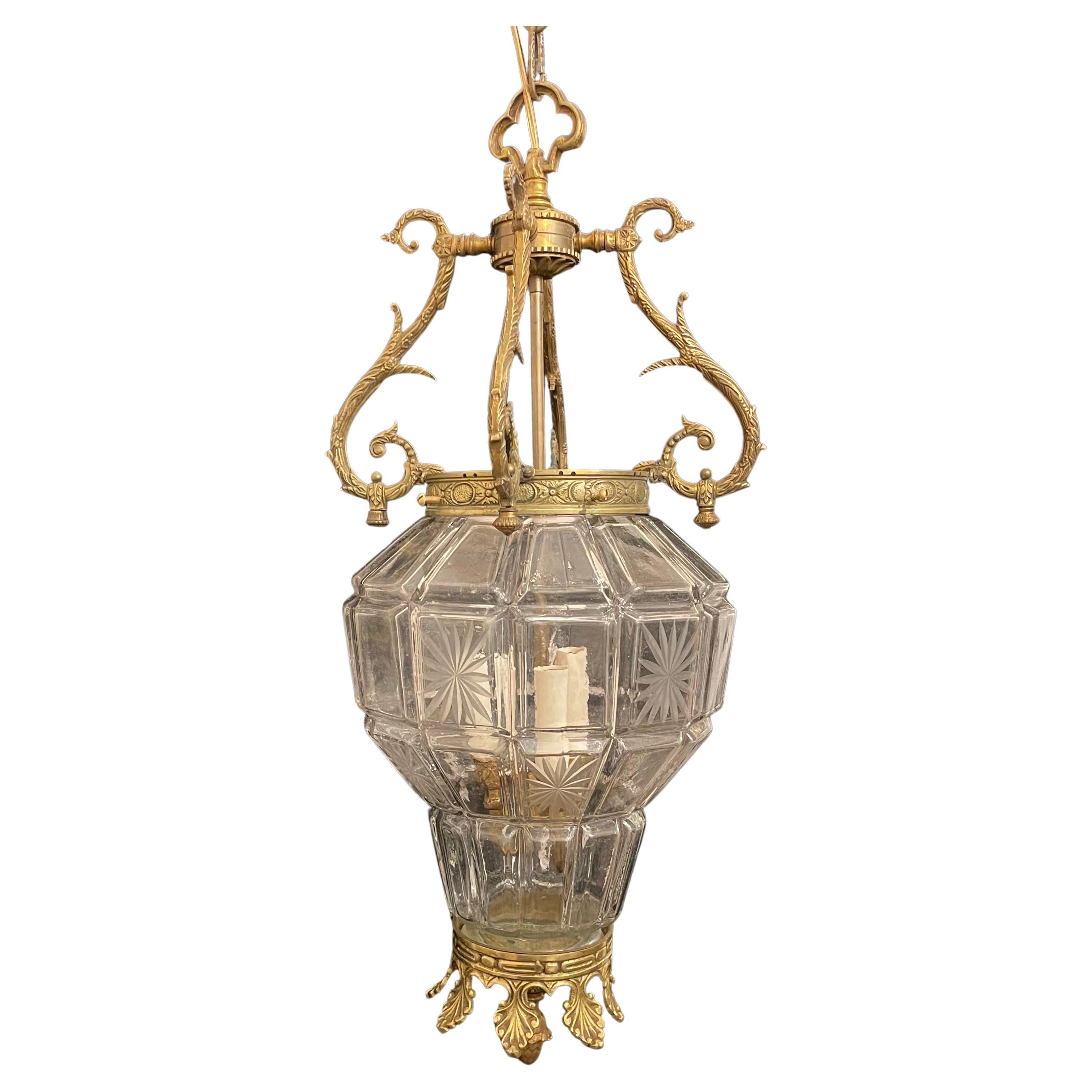 A wonderful large french bronze regency empire style etched panel glass lantern fixture with 3 candelabra lights on the interior.