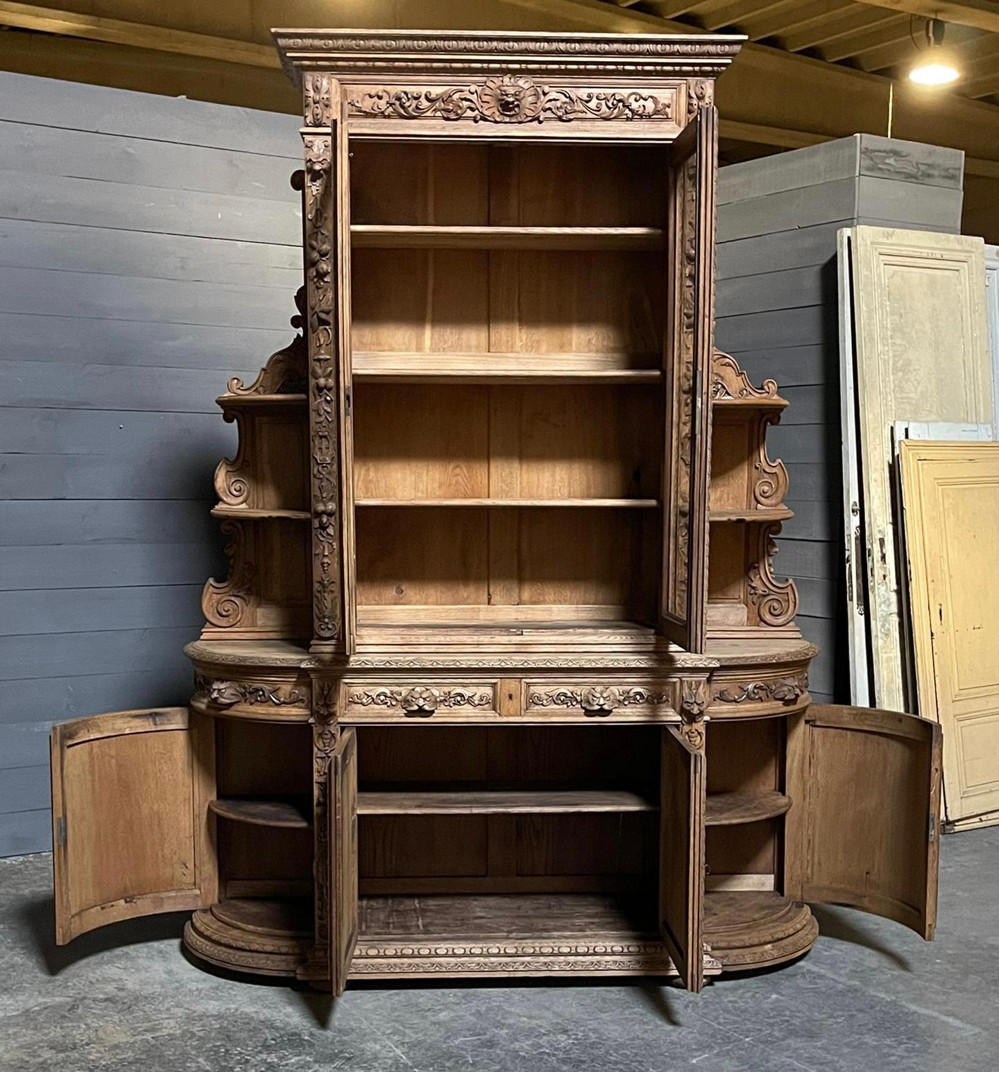 We are very pleased to be able to offer this incredible French Oak Hunting Sideboard or Cabinet. Dating to around 1870 and having incredible carvings, the top section has 2 glazed doors (key present) which open to reveal 3 shelves. The lower section