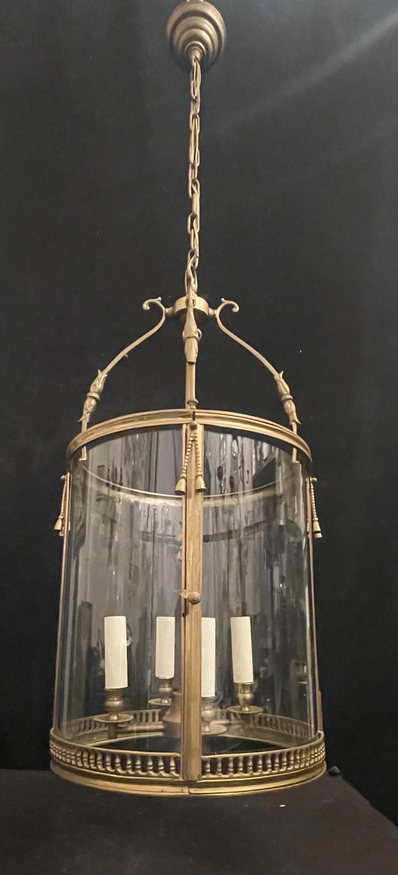 A wonderful large French Louis XVI style bronze with tassels 4 candelabra light lantern fixture this chandelier comes ready to install with updated wiring & chain, canopy and mounting hardware.