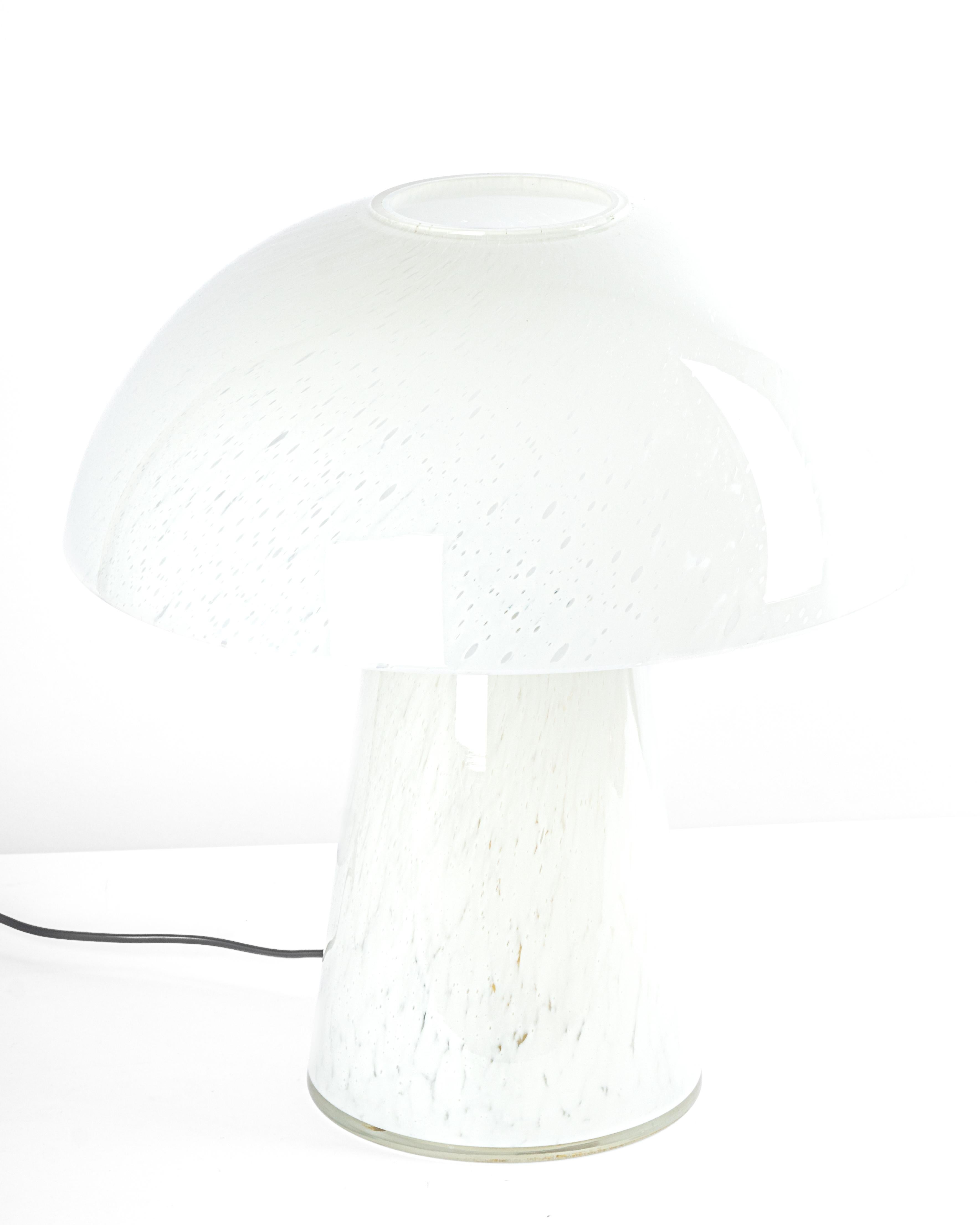 Wonderful mushroom table lamp by Limburg, Germany, 1970s. Made of a single piece.
Great glass body and its edgy quality contrast nicely with the smooth surface and shape of the mushroom. 

Measures: Large table lamp
Height 47 cm // 18.5
