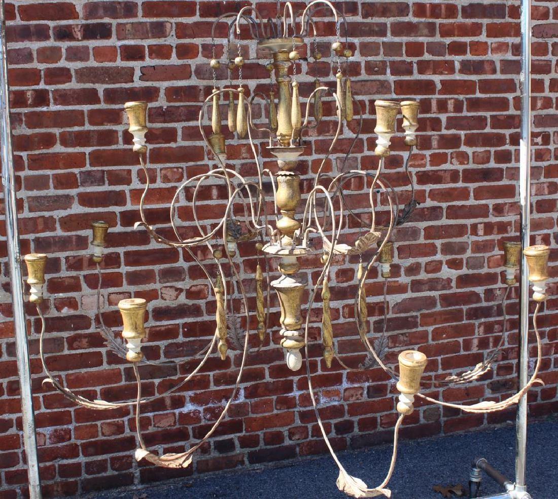A wonderful large Italian iron and gold giltwood white wash spindle 12-arm two-tier modern rustic chandelier
We can have them electrified for you for additional $350.

We have 4 available, each sold individually.