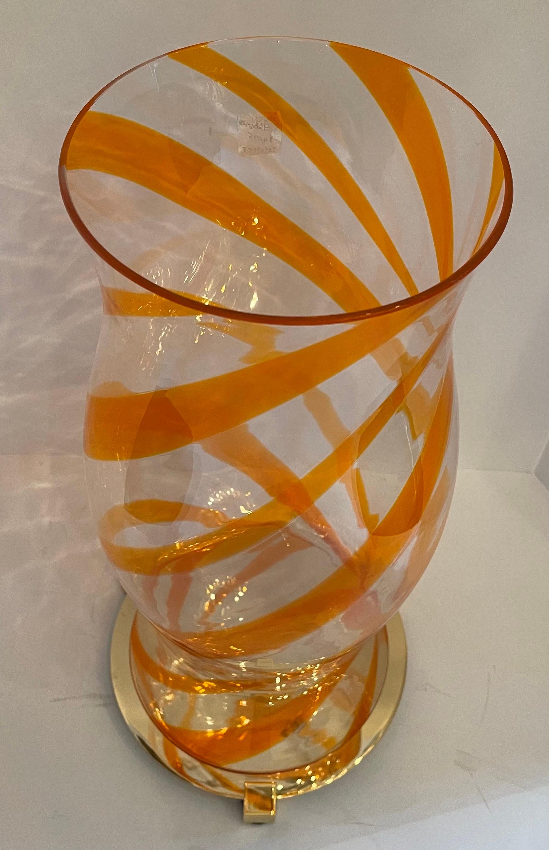 A wonderful large Mid-Century Modern Lorin Marsh hand blown art glass Murano orange swirl hurricane shade sitting on a polished brass base

Retains Orig. Lorin Marsh Sticker With Retail Over $4,000.