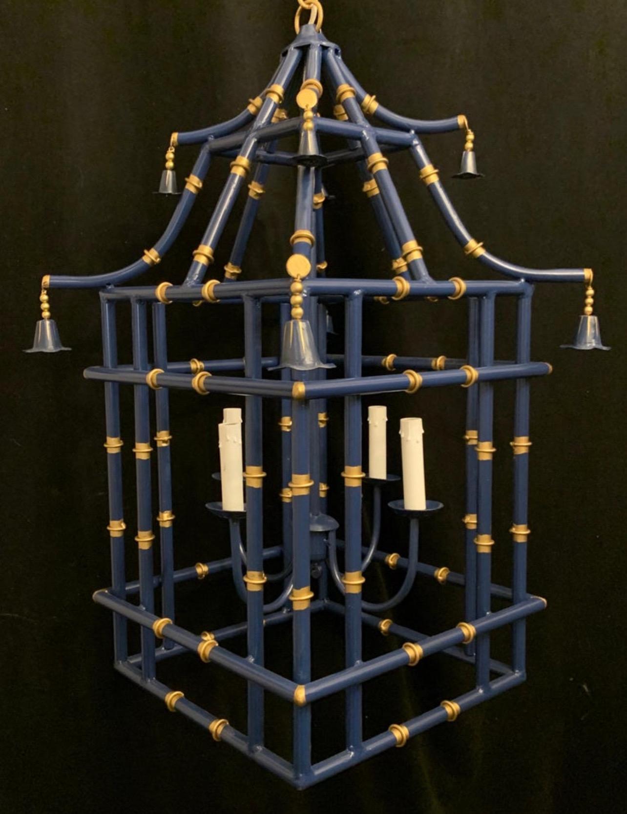 Available are 3 wonderful large navy blue gold gilt pagoda bamboo chinoiserie lanterns each with 4-candelabra light fixtures, ready to install with chain and canopy

Each lantern sold separately 
