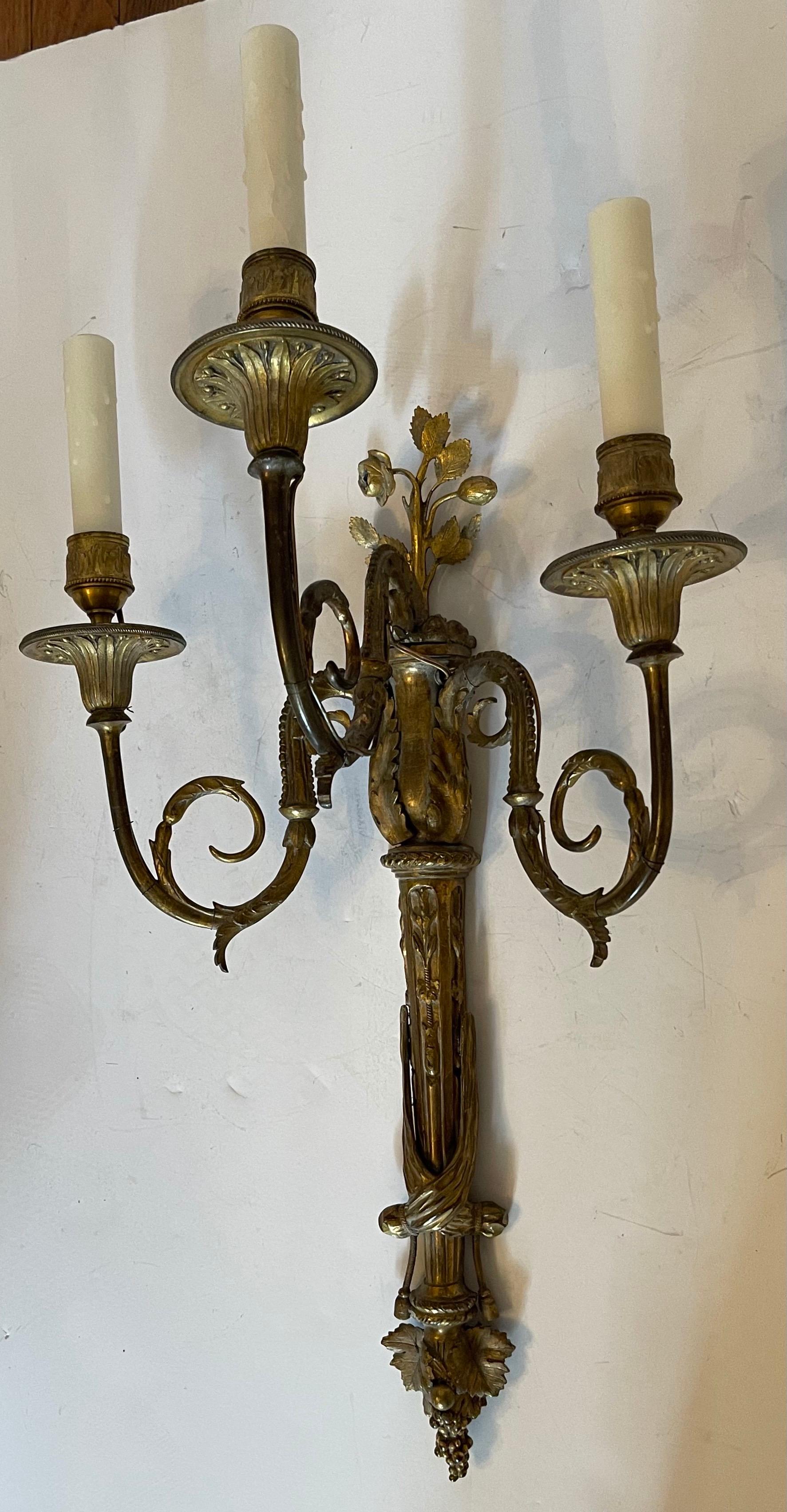 A Wonderful large pair of French Empire Dore bronze Torchiere neoclassical tassel three candelabra light sconces.