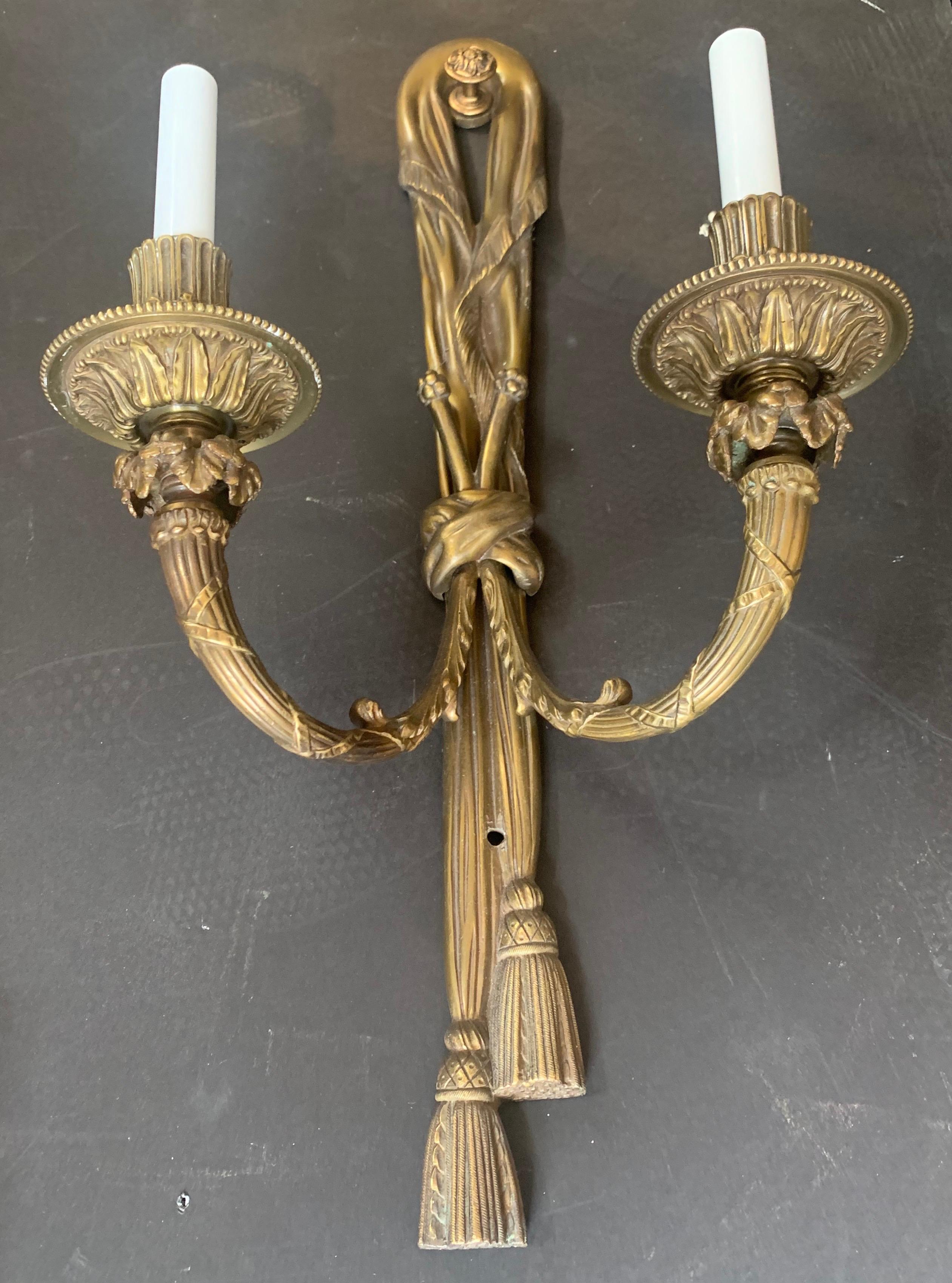 Large Pair of Gilt Bronze E.F. Caldwell Two-Light Ribbon Tassel Sconces In Good Condition For Sale In Roslyn, NY