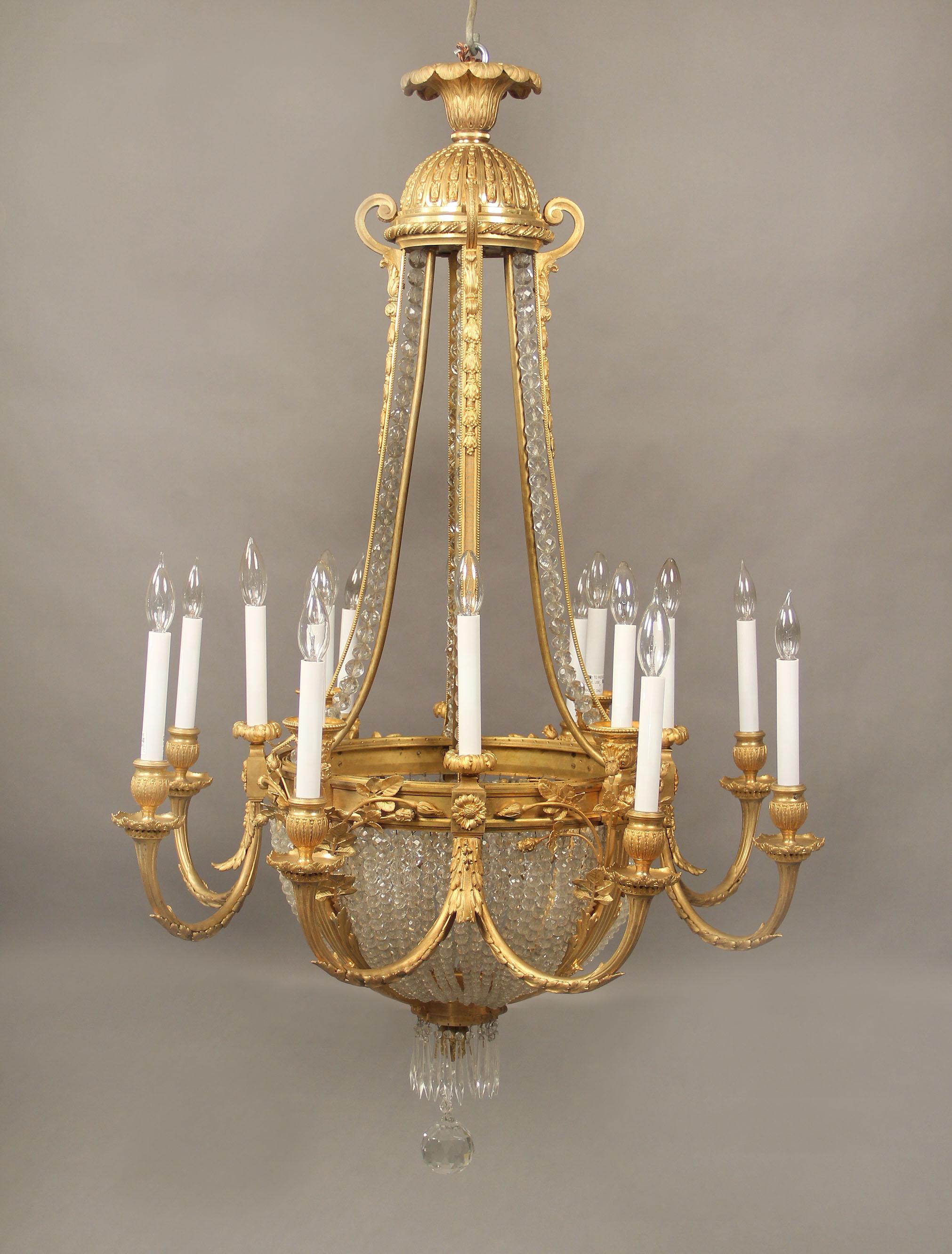 A wonderful late 19th century gilt bronze and beaded crystal sixteen-light chandelier.

Bronze arms with flowers, with a dome top and a beaaded basket bottom, sixteen-tiered perimeter lights.

 