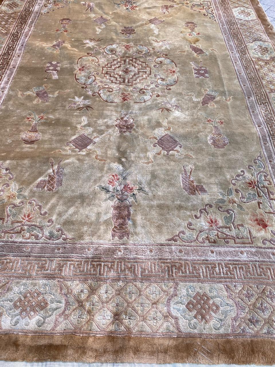 Very beautiful late 20th century Chinese silk rug with a Chinese design and light colors with brown, beige, green and pink, entirely and finely hand knotted with silk velvet on silk foundation.