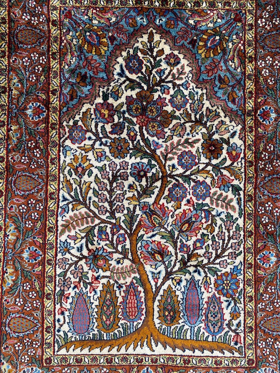 Very beautiful late 20th century little rug with a beautiful design of the tree of life, with beautiful flowers and nice colors, entirely and very finely hand knotted with silk velvet.