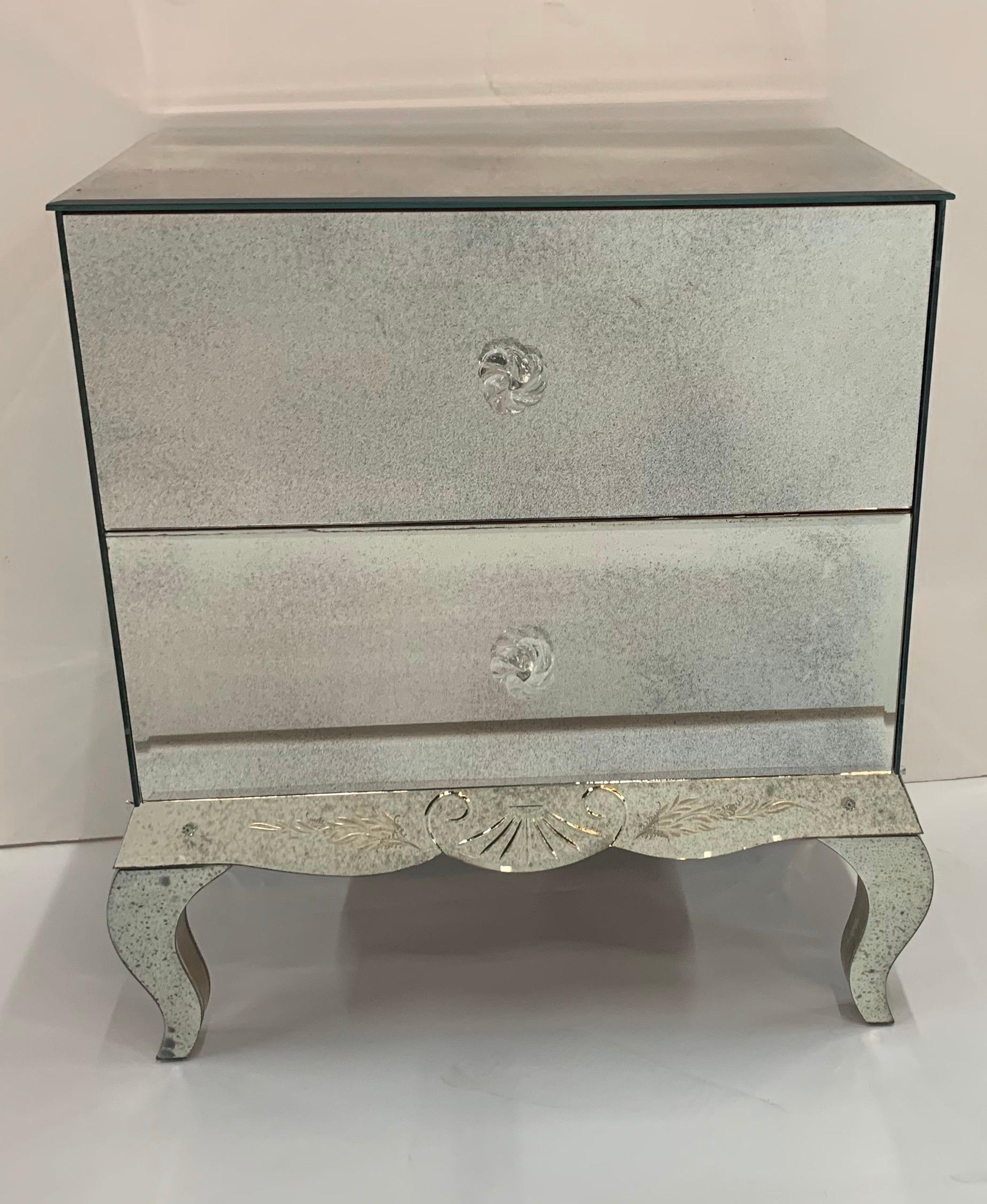 A wonderful Lorin Marsh etched two-drawer mirrored chest with flower rosette pulls and silver-leaf details

Top measurements: 
24” W x 15 1/4” D
Total height 28” H
26 1/2” wide by the legs
16” deep to the pulls.
 