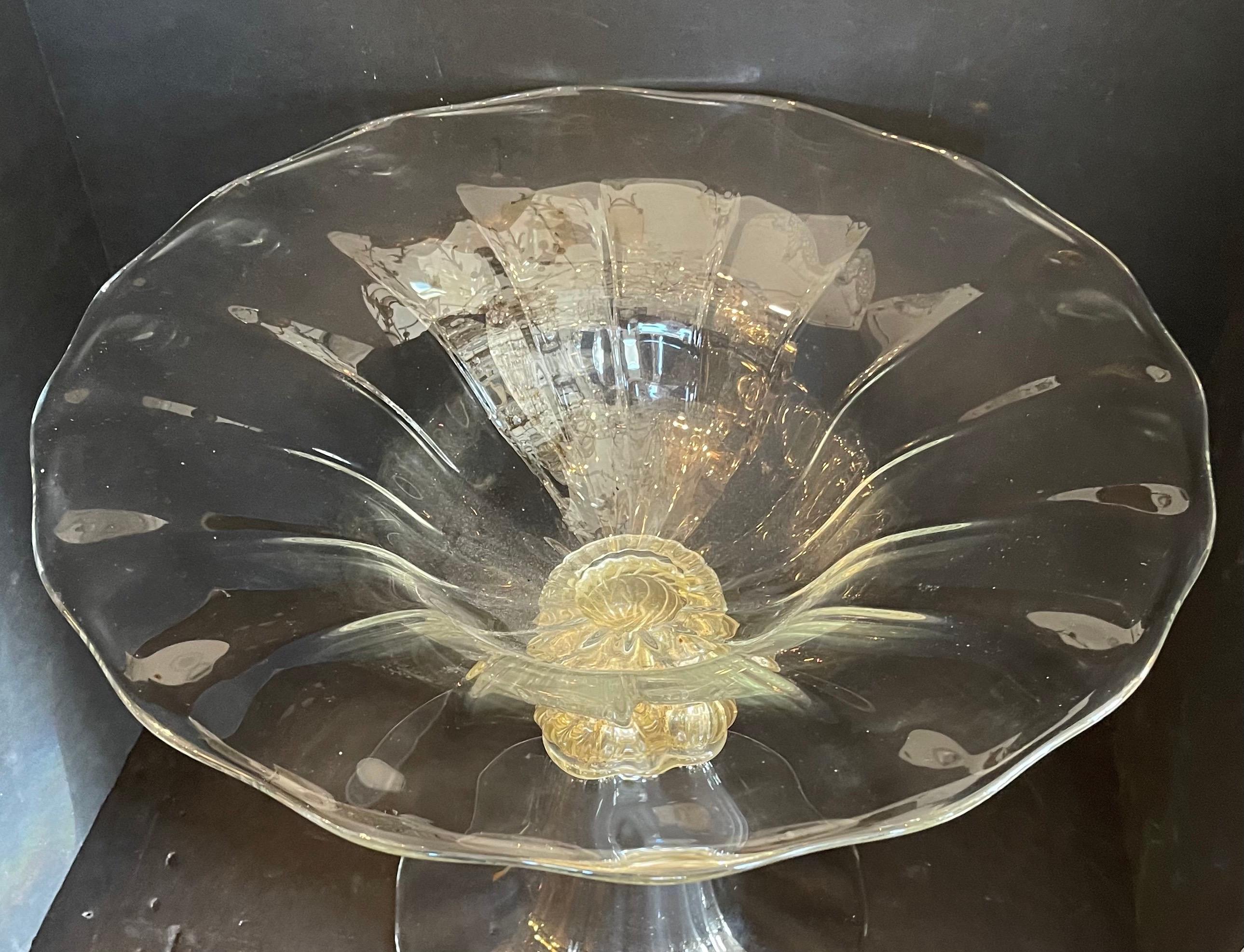 A wonderful Lorin Marsh retailed murano clear & gold swirl flecked large art glass centerpiece bowl in the manner of Seguso.
Signed 2000, signature is difficult to make out.
