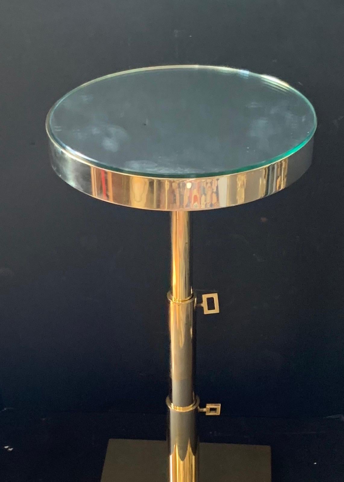 A wonderful Lorin Marsh polished bronze round mirrored top telescoping side table
Top is 12