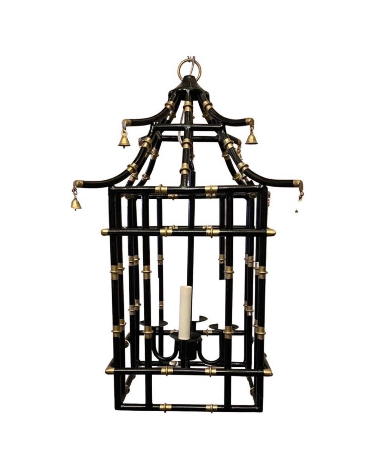 A wonderful medium sized black & gold gilt pagoda bamboo form chinoiserie lantern fixture with 4 candelabra light cluster, each socket with a max of 40 watts.

Rewired and ready to install with chain canopy and mounting hardware.

