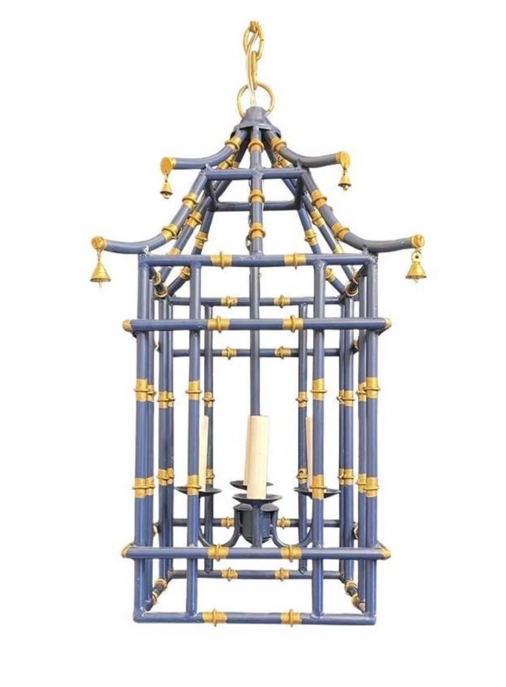 A wonderful medium sized navy blue & gold gilt pagoda bamboo form chinoiserie lantern fixtures with a 4 candelabra light clusters
Rewired and ready to install with chain canopy and mounting hardware.

Pair lanterns currently available
Each sold