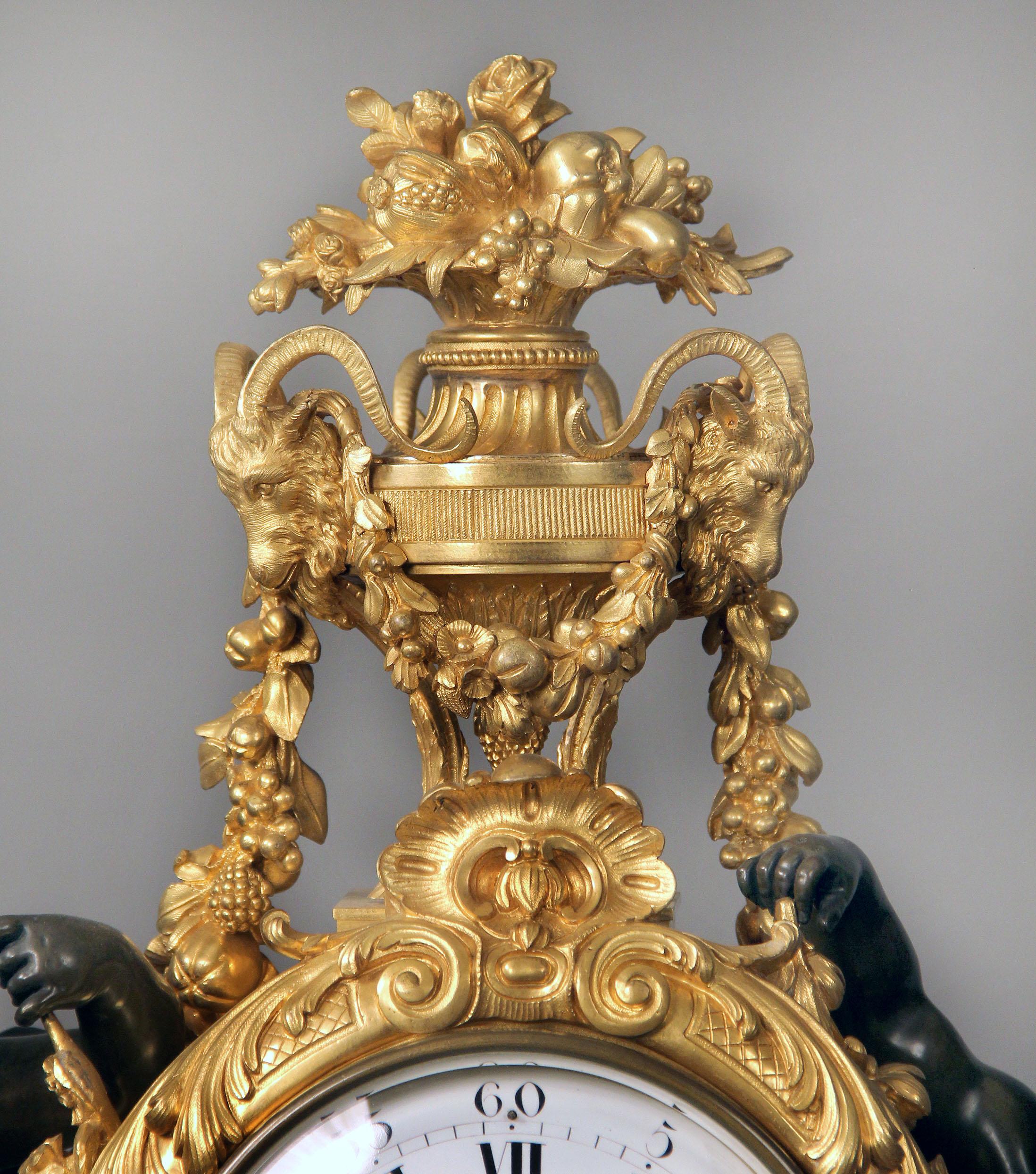 A large and wonderful quality mid-19th century Napoleon III gilt and patinated bronze figural mantle clock. 

By Henri Picard

The top surmounted by a festive urn topped with a bouquet of fruit, flowers, and wheat, surrounded by three ram heads,