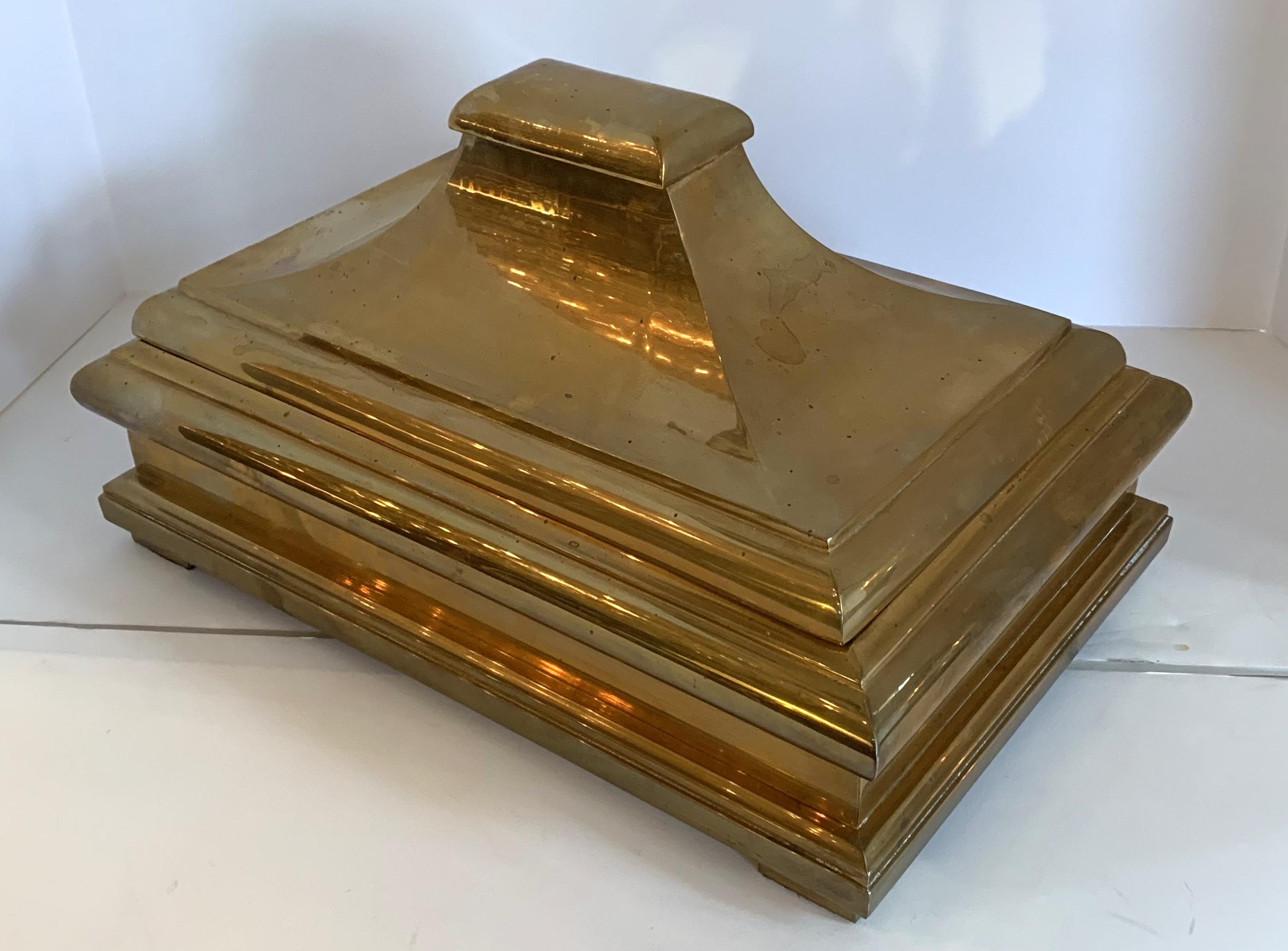 A wonderful Mid-Century Modern brass / bronze pagoda form box with lid, circa 1978 with a black felt interior along with pads on the feet. Has not been polished, but will certainly sparkle when done.