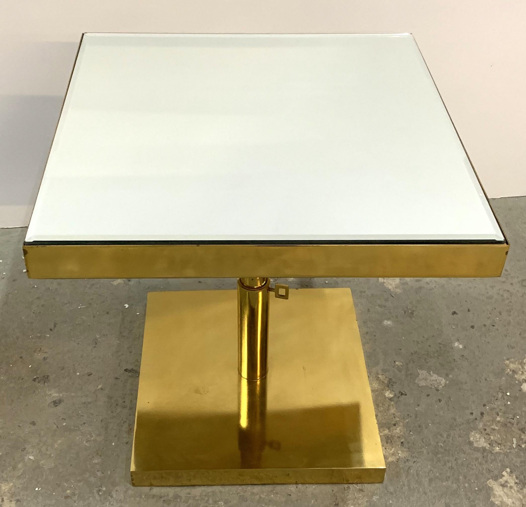 A wonderful Mid-Century Modern bronze and beveled mirror, telescoping square side table height is adjustable by 2 knobs.
Purchased from Lorin Marsh.