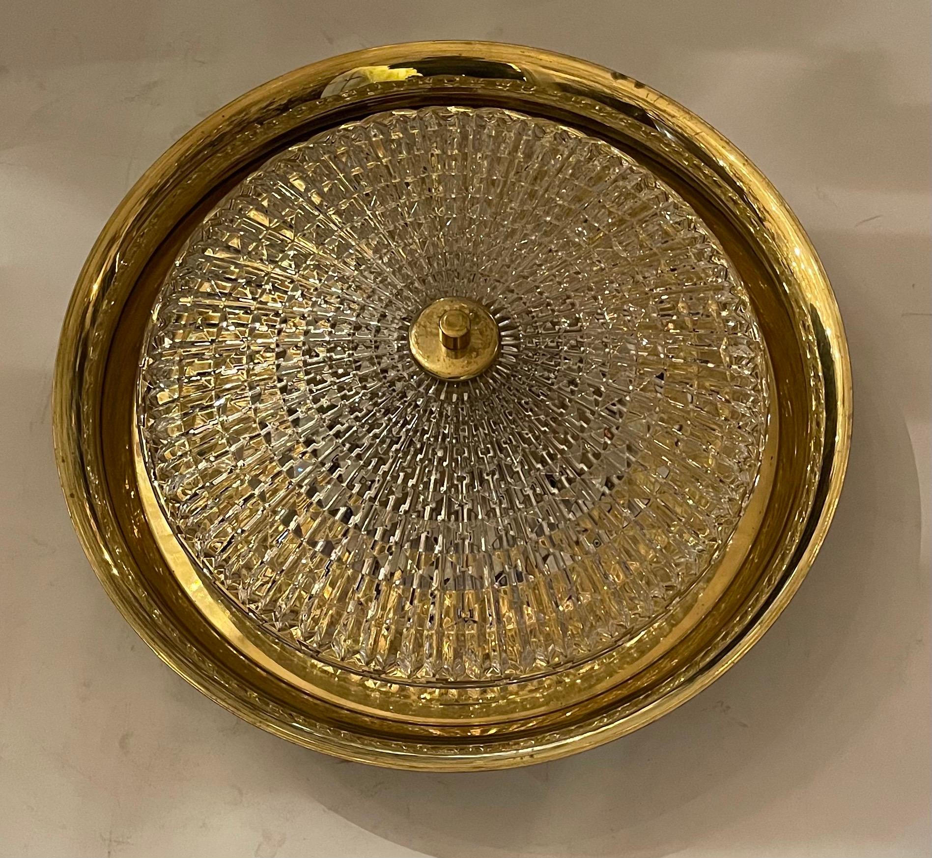 A beautiful Scandinavian Modern brass and textured glass light fixture by Carl Fagerlund for Orrefors/Lyfa, Sweden, manufactured in mid century, circa 1960. It can be used as wall or ceiling fixture.
The light has five candelabra sockets for small