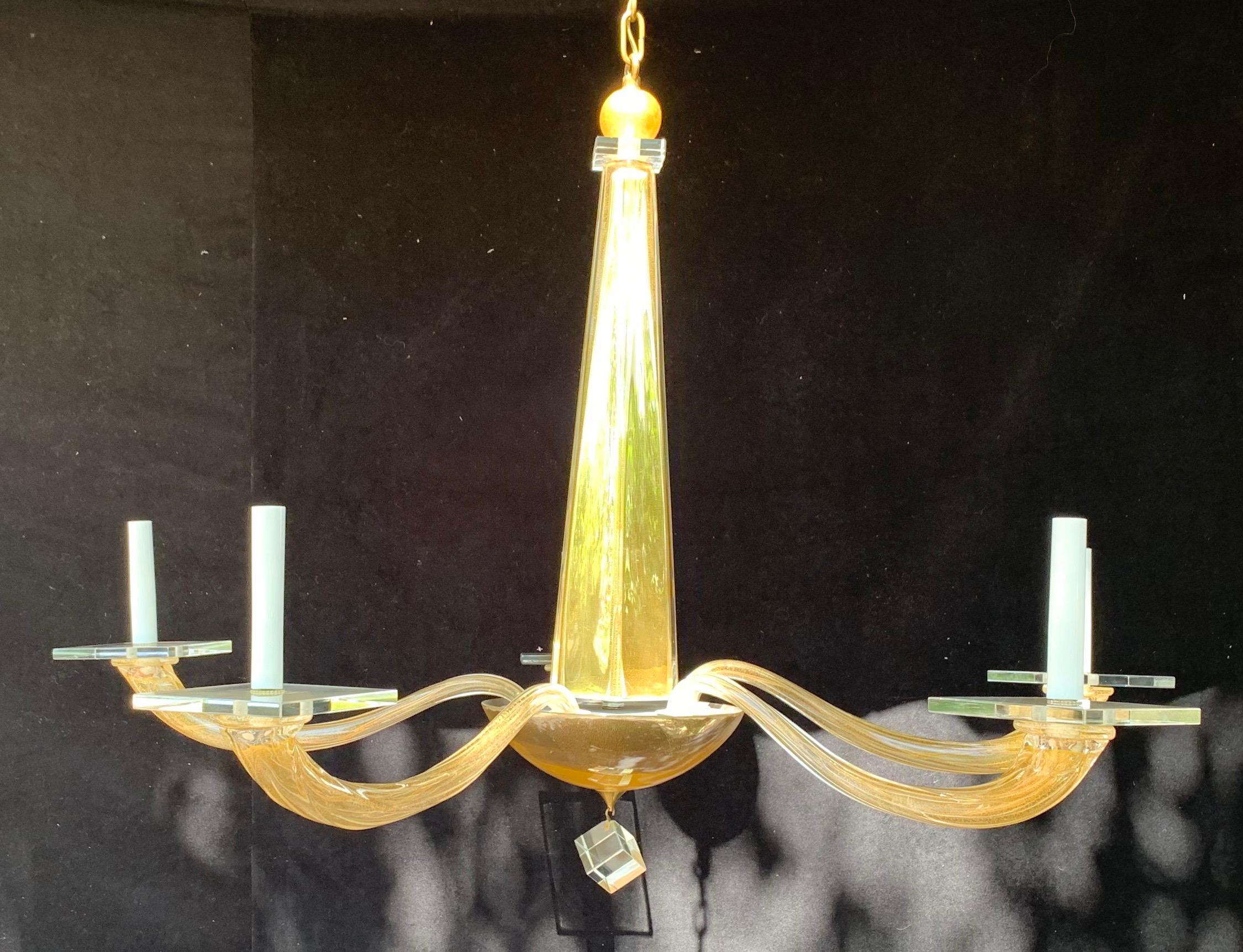 A wonderful Mid-Century Modern Donghia Stellare Italian Murano blown twisted art glass with gold dust
Completely rewired with new candelabra sockets 

Measures: Height 31 inches X diameter 41 inches W/O chain and canopy.
 