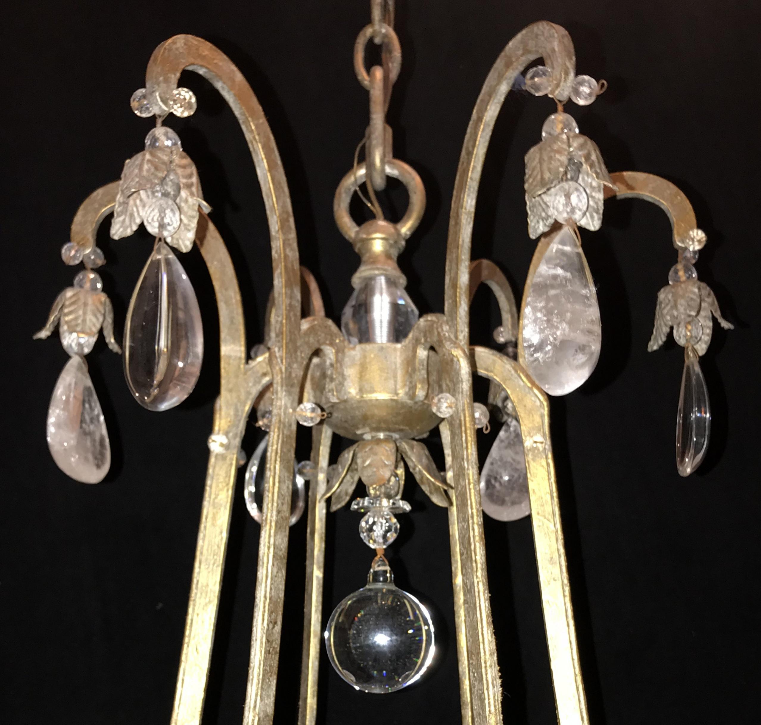 A wonderful Mid-Century Modern gold gilt Baguès / Jansen style rock crystal and bead flower chandelier, with a large centre finial and finished off with a rock crystal ball on the bottom.

Measures: 38” H x 32