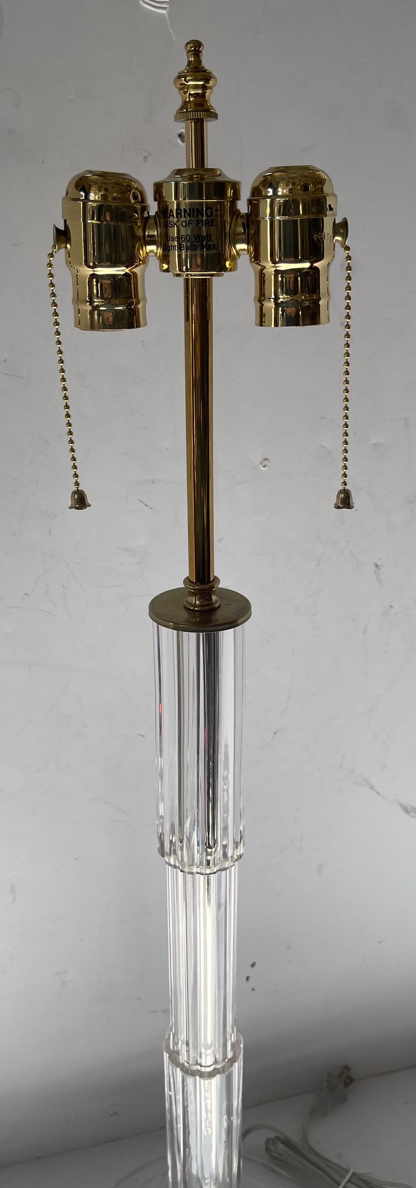 A wonderful Mid-Century Modern / Art Deco Italian Murano clear glass and polished brass single column lamp Rewired With A New Two Light Edison Cluster, retailed by Lorin Marsh NYC