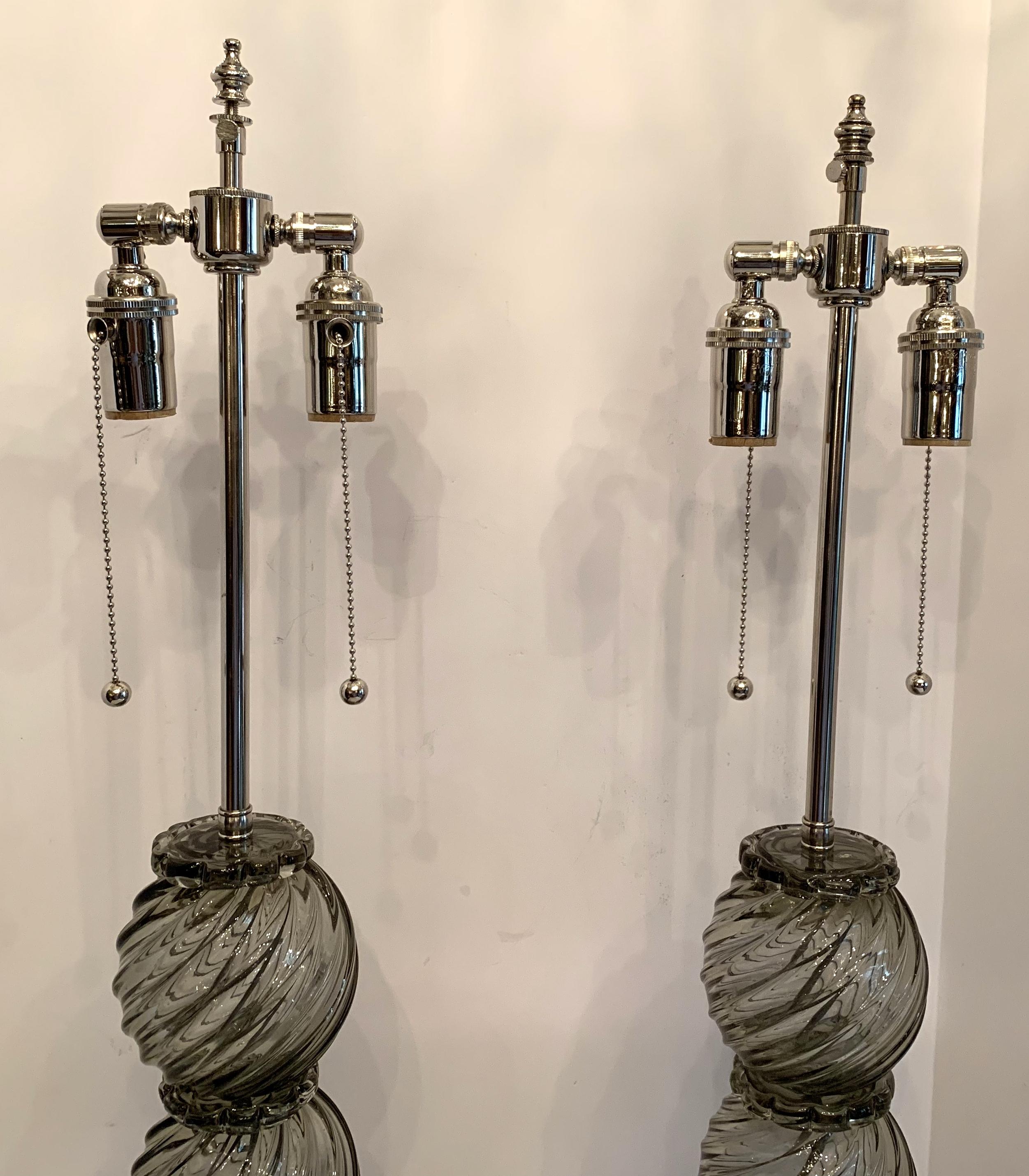A Wonderful pair of Mid-Century Modern Italian / Murano Venetian swirl form smoke grey color art glass lamps in the Art Deco style with new polished nickel fittings and wiring.