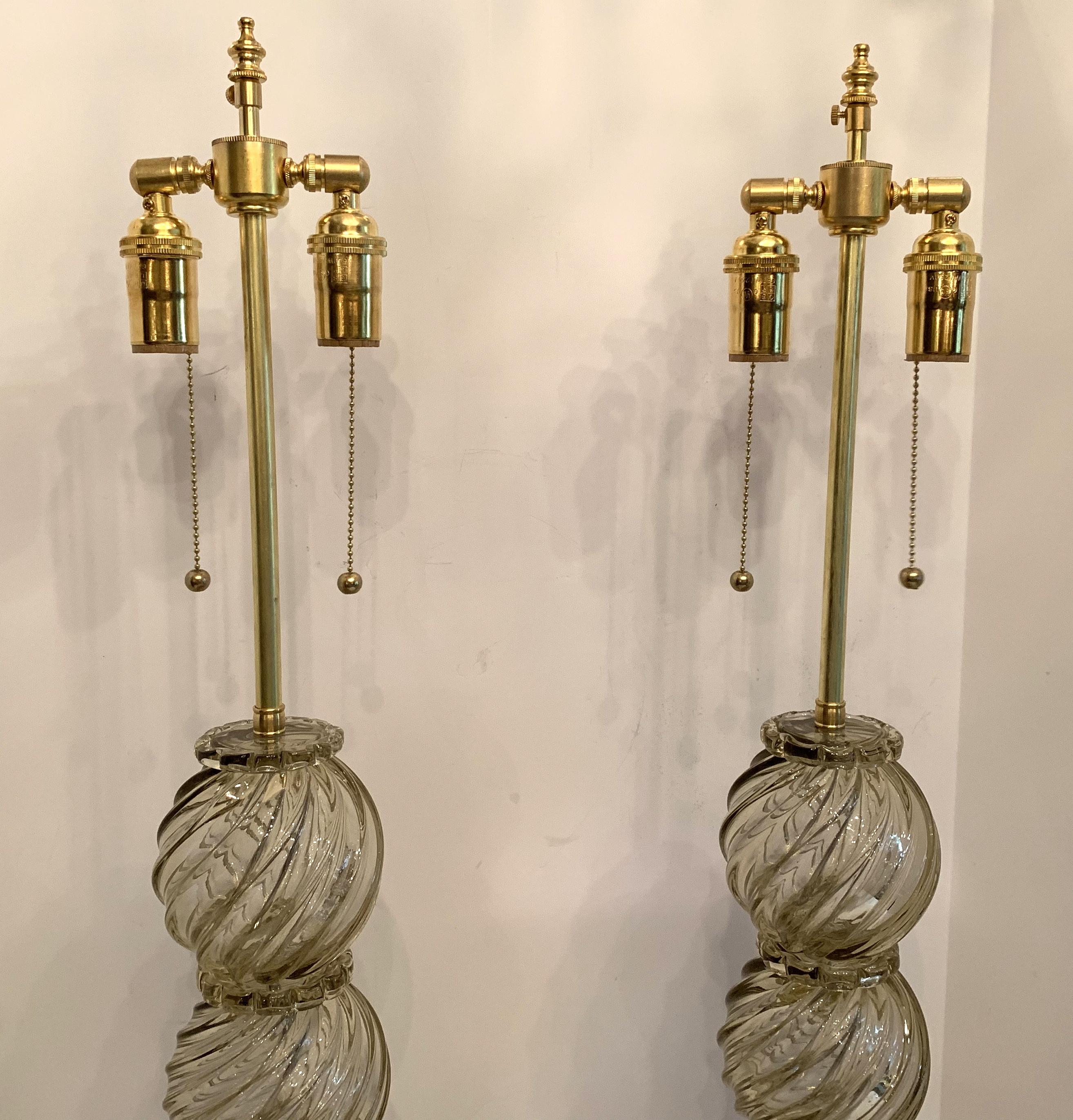 A Wonderful pair of Mid-Century Modern Italian / Murano Venetian swirl form pale gold / yellow color art glass lamps in the Art Deco style with new brass fittings and wiring.