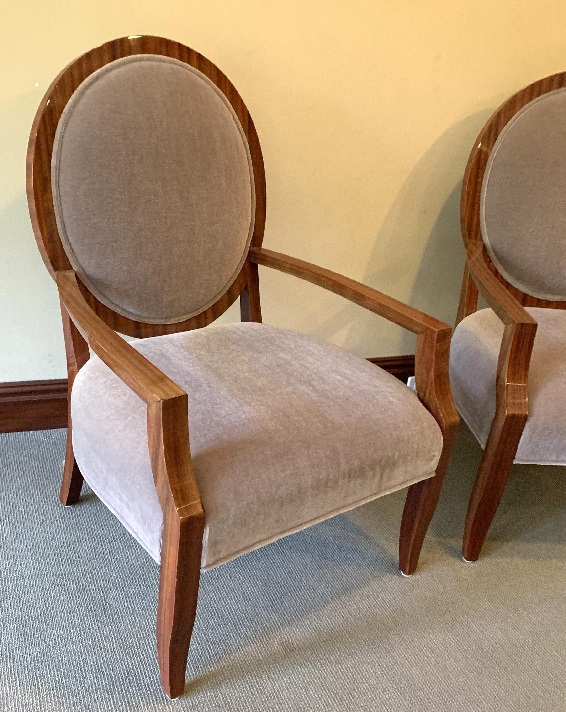 Wonderful pair of Mid-Century Modern pair of Macassar wood and mohair grey upholstery oval back armchairs.