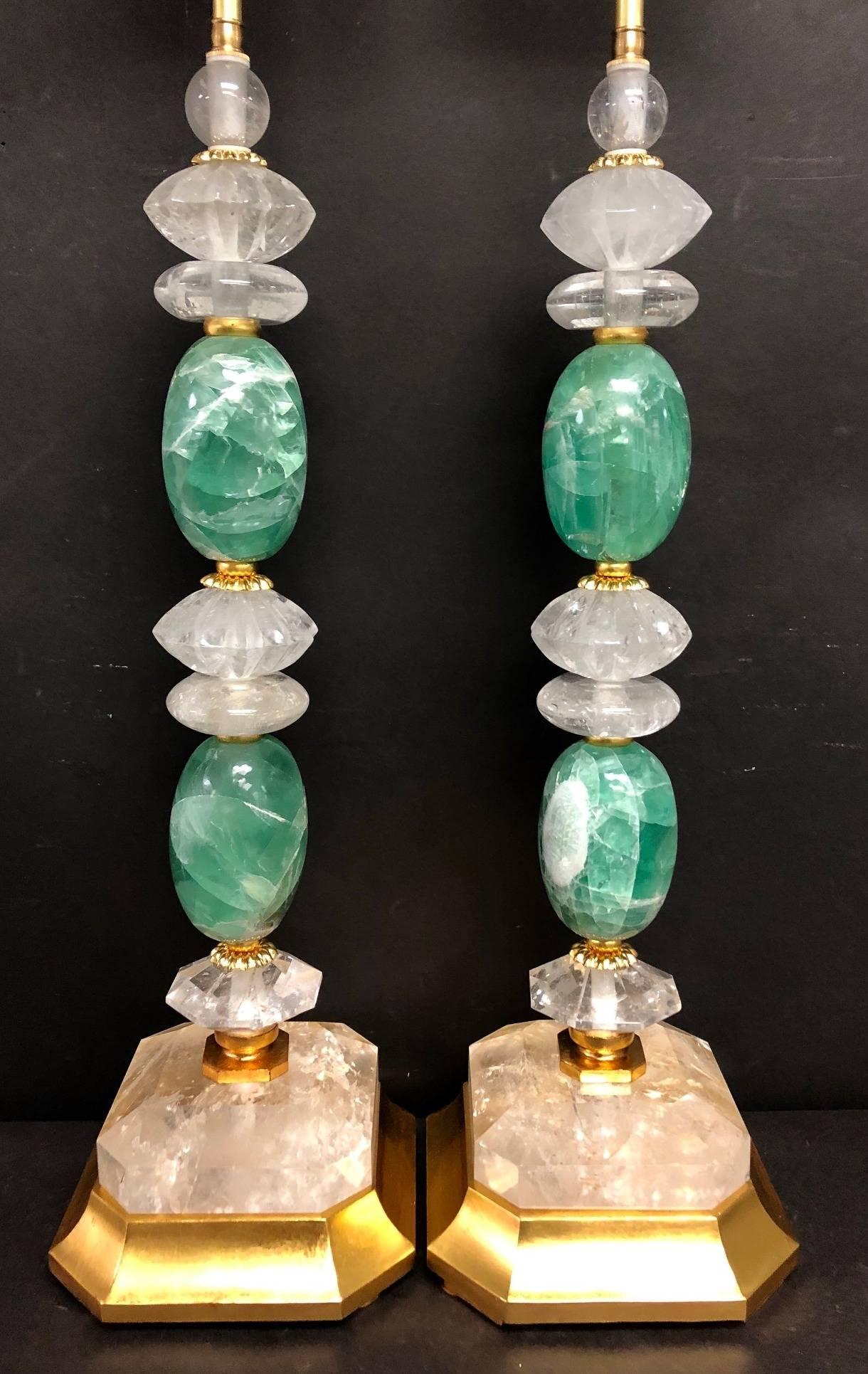 A wonderful Mid-Century Modern pair of rock and green quartz crystal gold gilt lamps completely rewired and ready to enjoy.